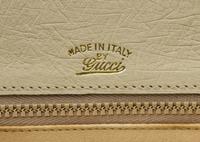 A Gucci Cream Ostrich Bamboo Top Handle Bag, 10.5" x 7.5" x 3".