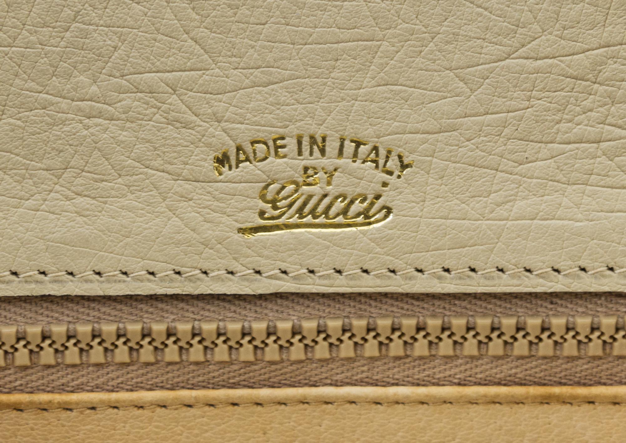 A Gucci Cream Ostrich Bamboo Top Handle Bag, 10.5" x 7.5" x 3".