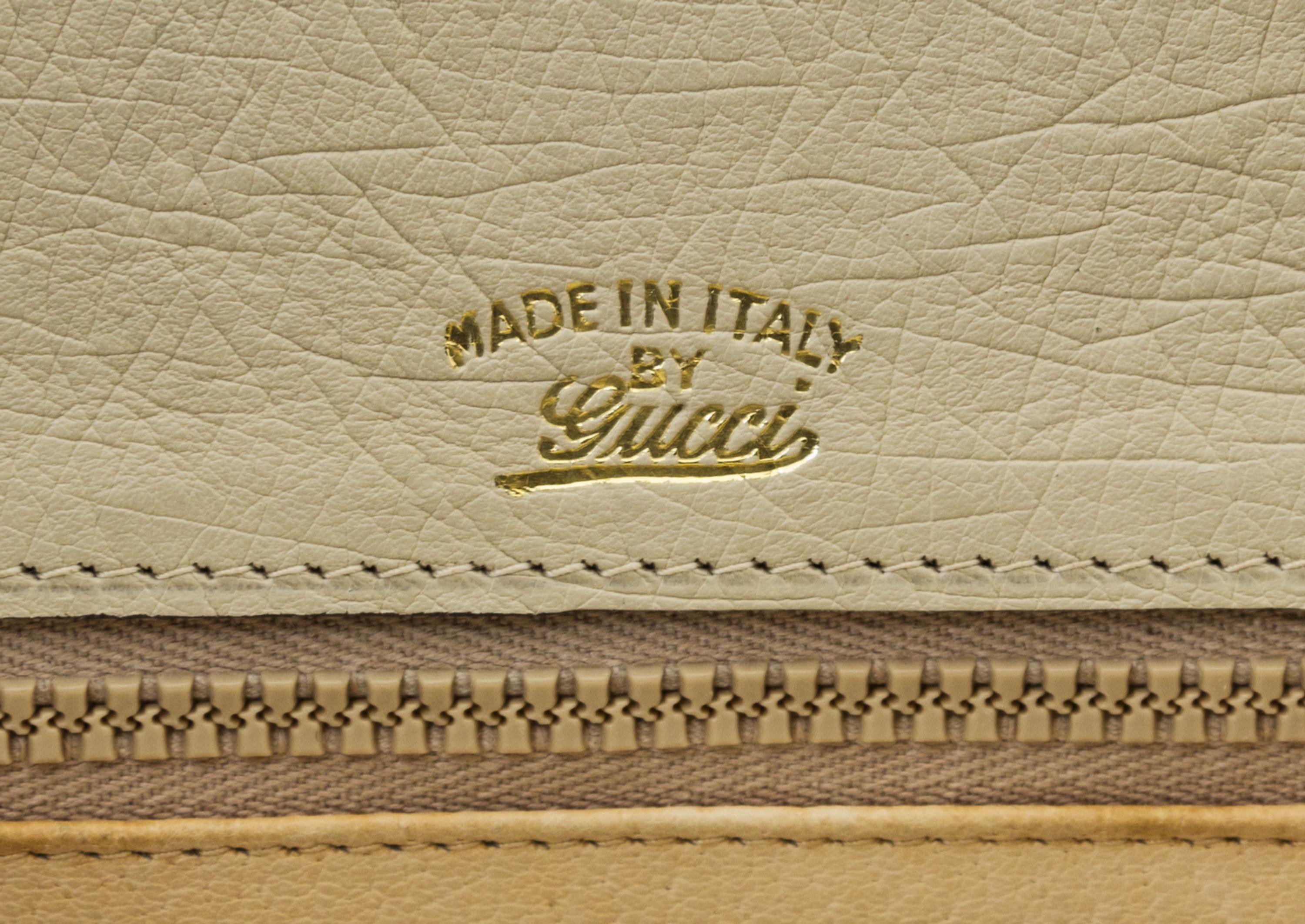 A Gucci Cream Ostrich Bamboo Top Handle Bag, 10.5" x 7.5" x 3".