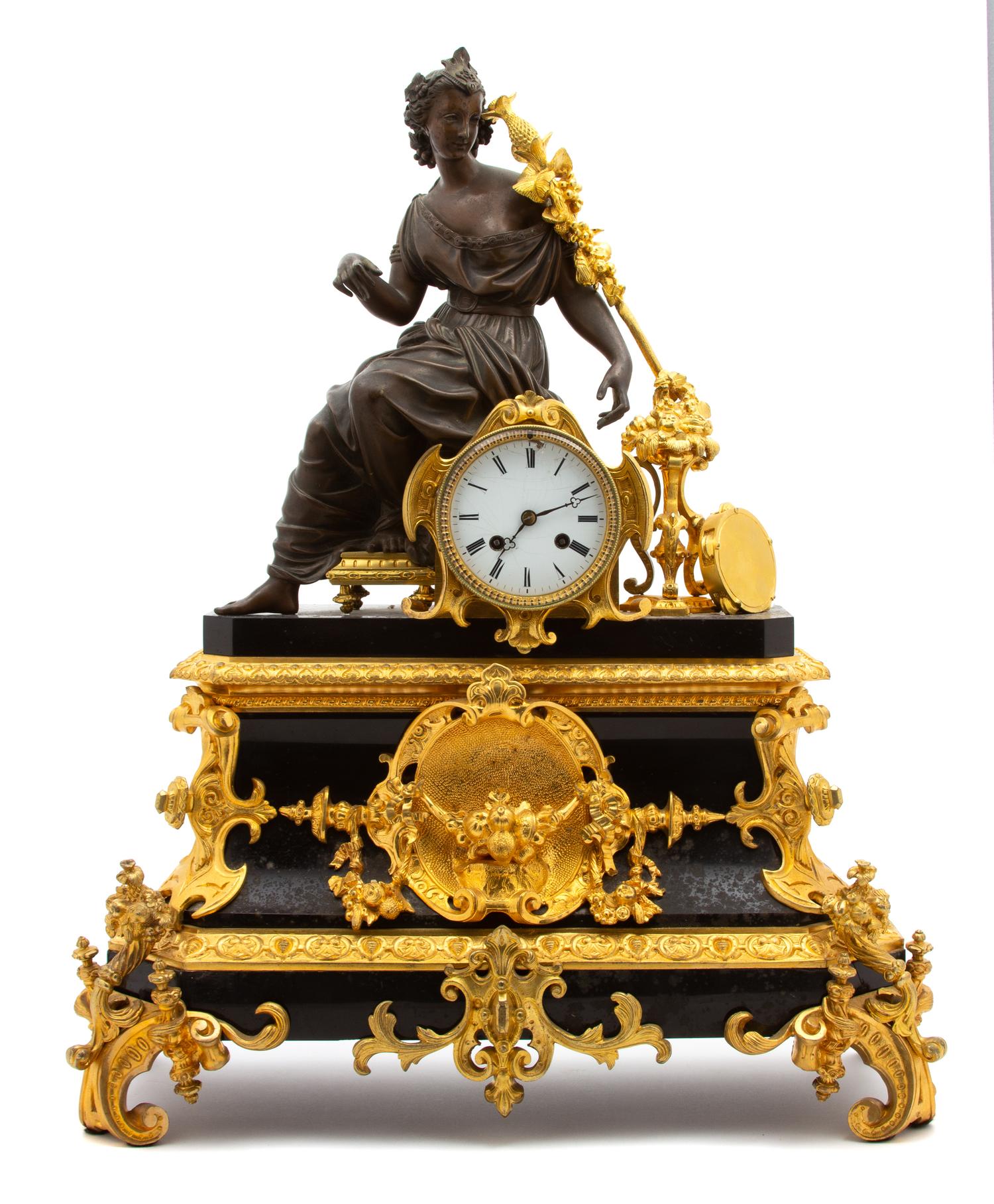 A Louis XV Style Gilt Bronze and Black Marble Mantle Clock Height 25 x width 19 1/2 inches. — LATE 19TH/EARLY 20TH CENTURY