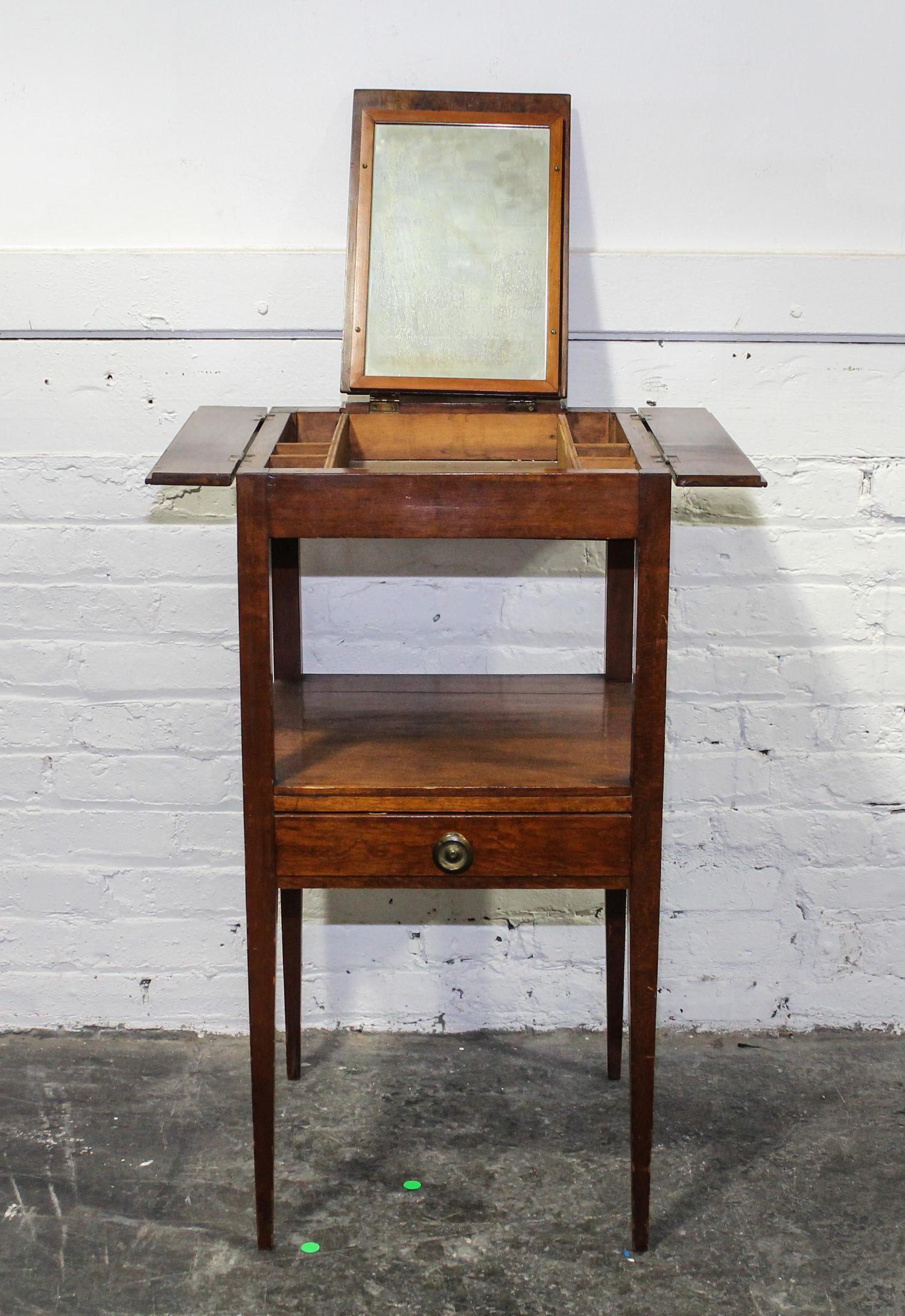 An English Mahogany Dressing Table Height 33 x width 16 x depth 16 3/4 inches (closed). — 19TH CENTURY