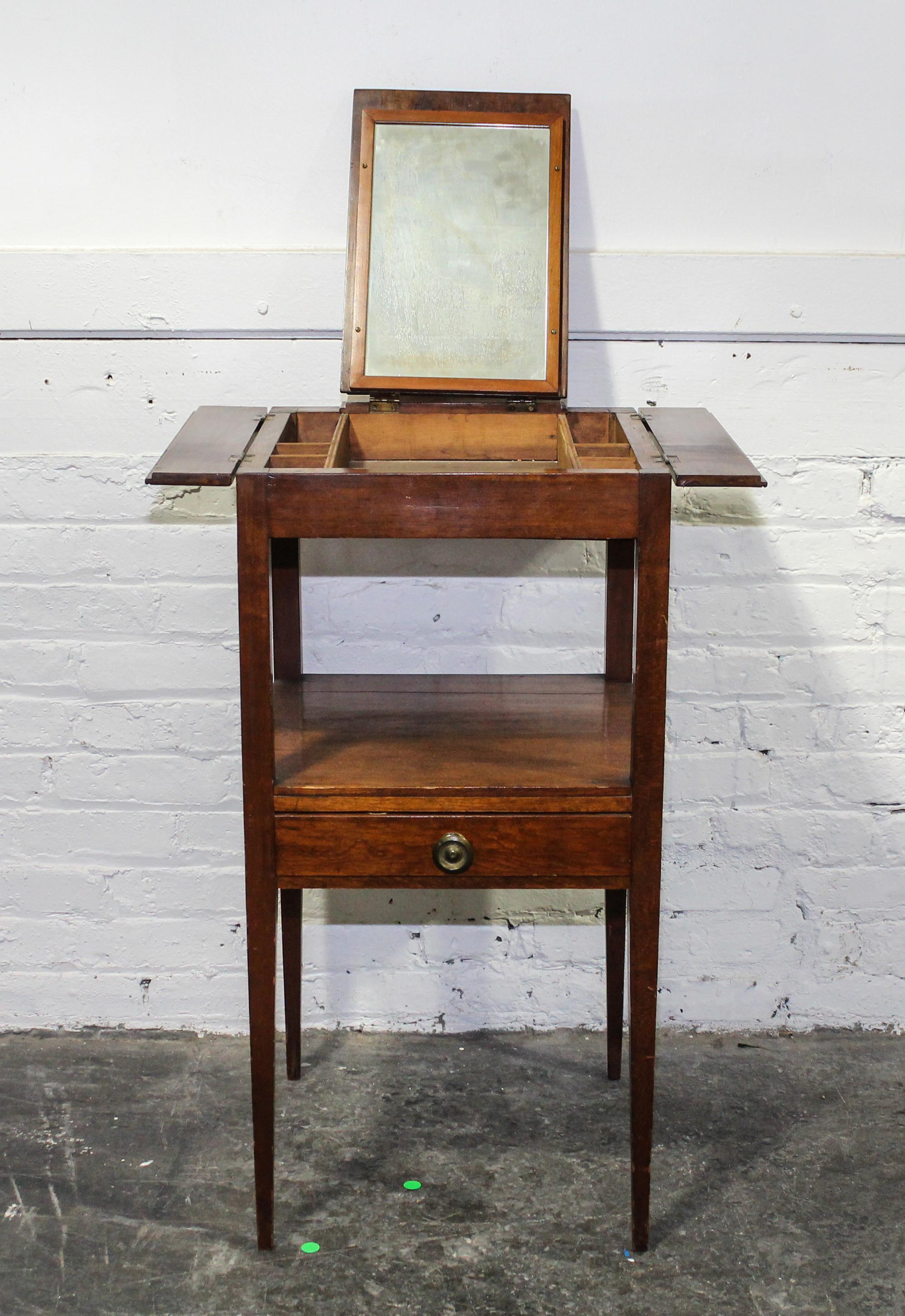 An English Mahogany Dressing Table Height 33 x width 16 x depth 16 3/4 inches (closed). — 19TH CENTURY