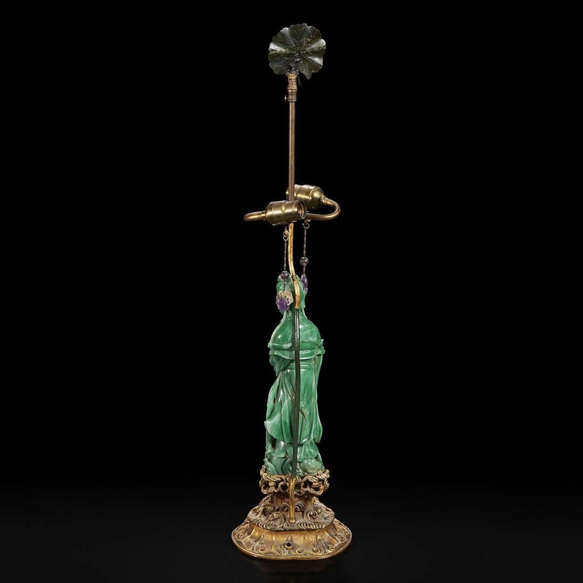 A Chinese carved green aventurine quartz Guanyin, mounted as a lamp 东陵石雕观音