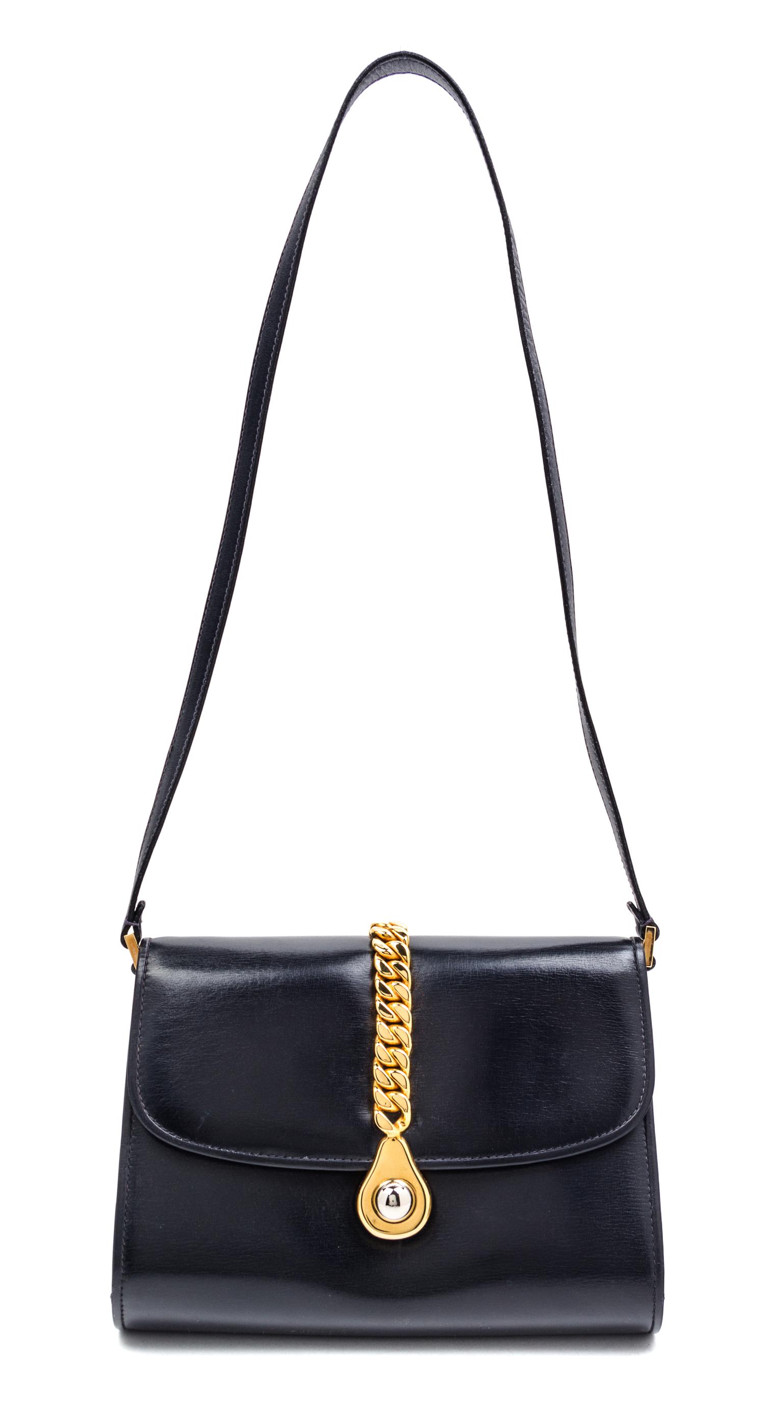 A Gucci Navy Leather Flap Handbag, 8" x 6" x 2".