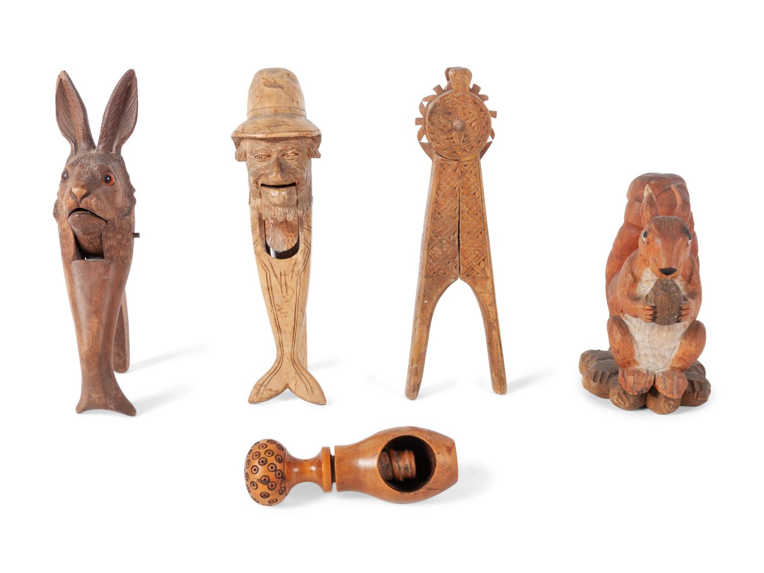 A Collection of Folk Art and Black Forest Carved Nut Crackers