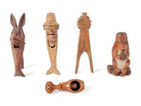 A Collection of Folk Art and Black Forest Carved Nut Crackers