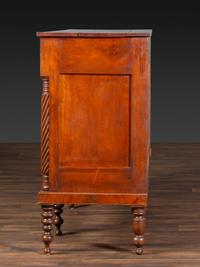 An American Empire Carved and Highly Figured Mahogany and Cherrywood Sideboard