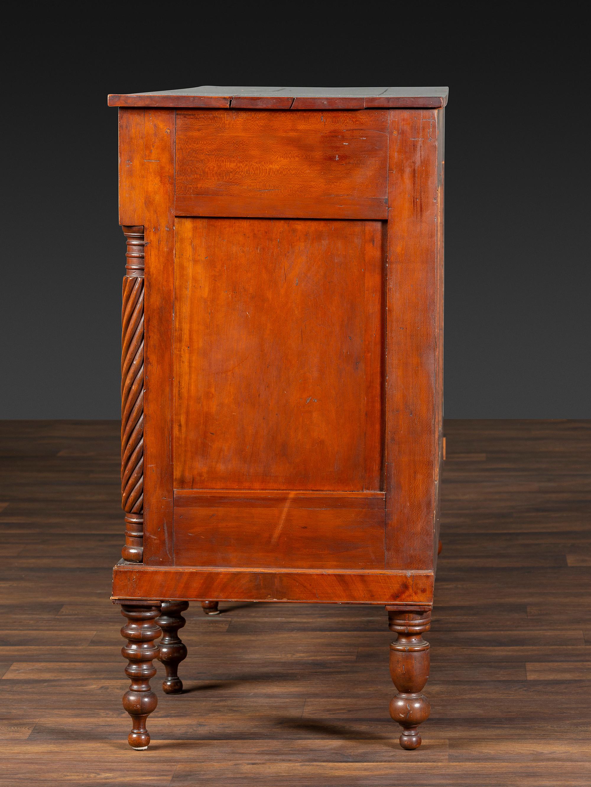 An American Empire Carved and Highly Figured Mahogany and Cherrywood Sideboard