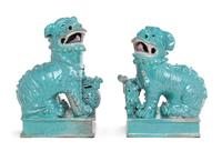 A Pair of Robin's Egg Glazed Porcelain Figures of Fu Lions Height of taller 10 1/4 inches. — 19TH CENTURY