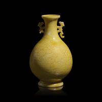 A Chinese Incised Yellow Glazed Small Vase, Qing Dynasty — 清 黃釉暗刻花鳥紋雙耳瓶
