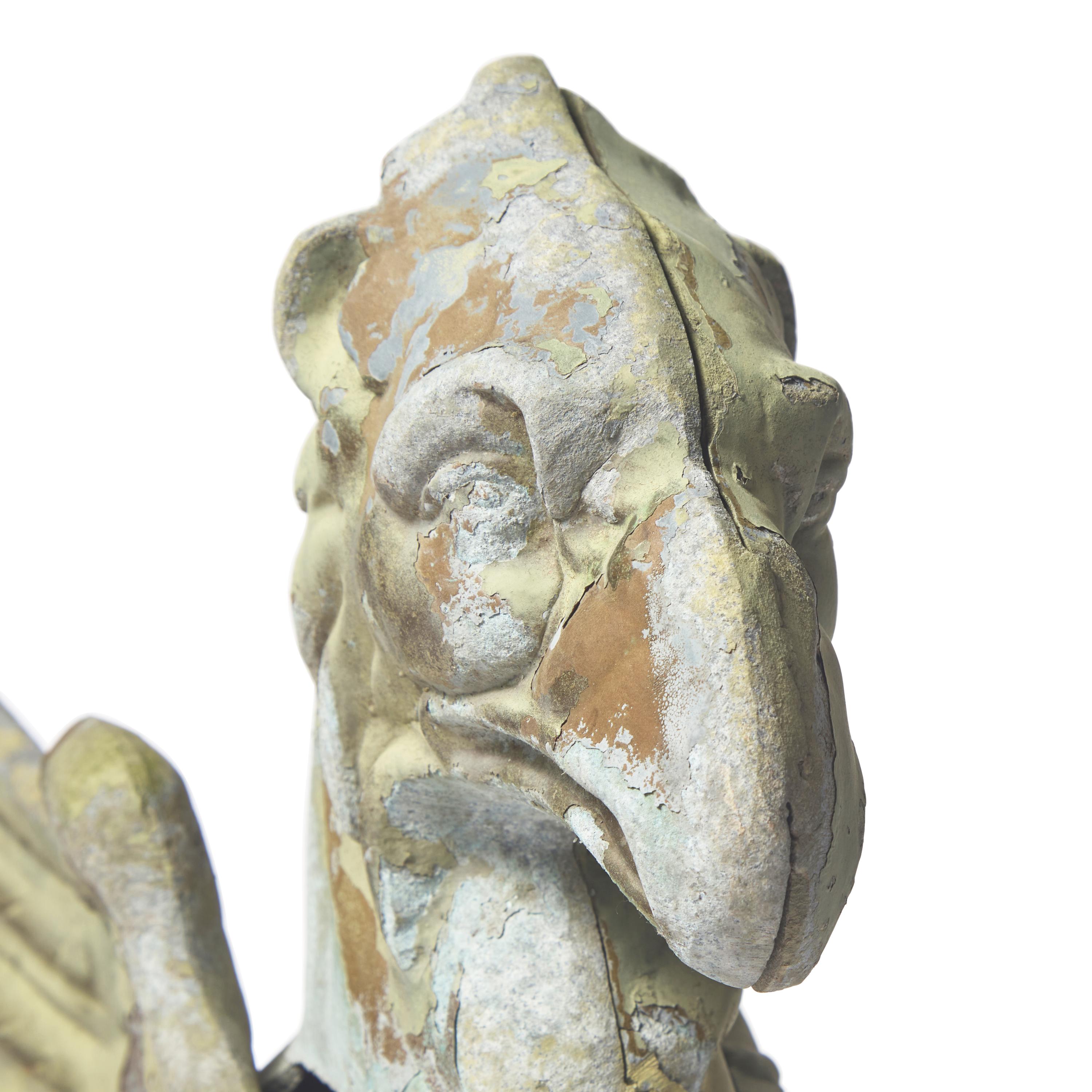 A Cast and Painted Zinc Garden Figure of a Griffin