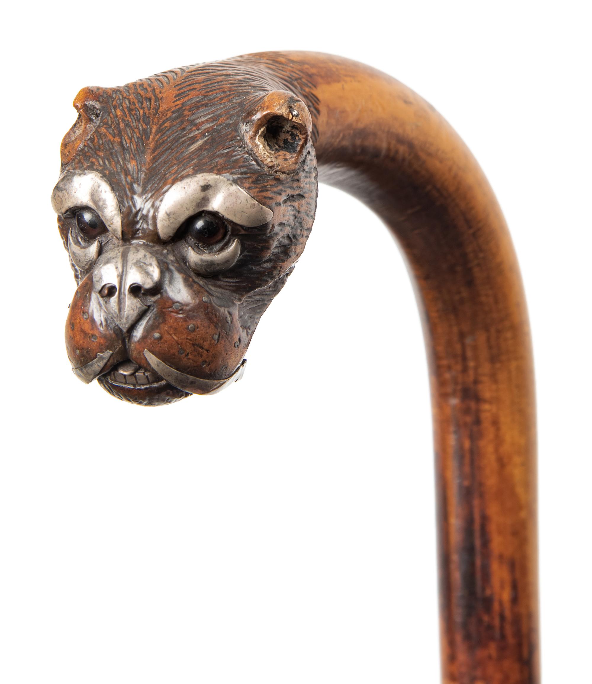 Two English Glass-Inset Carved Wood Dog's Head Canes