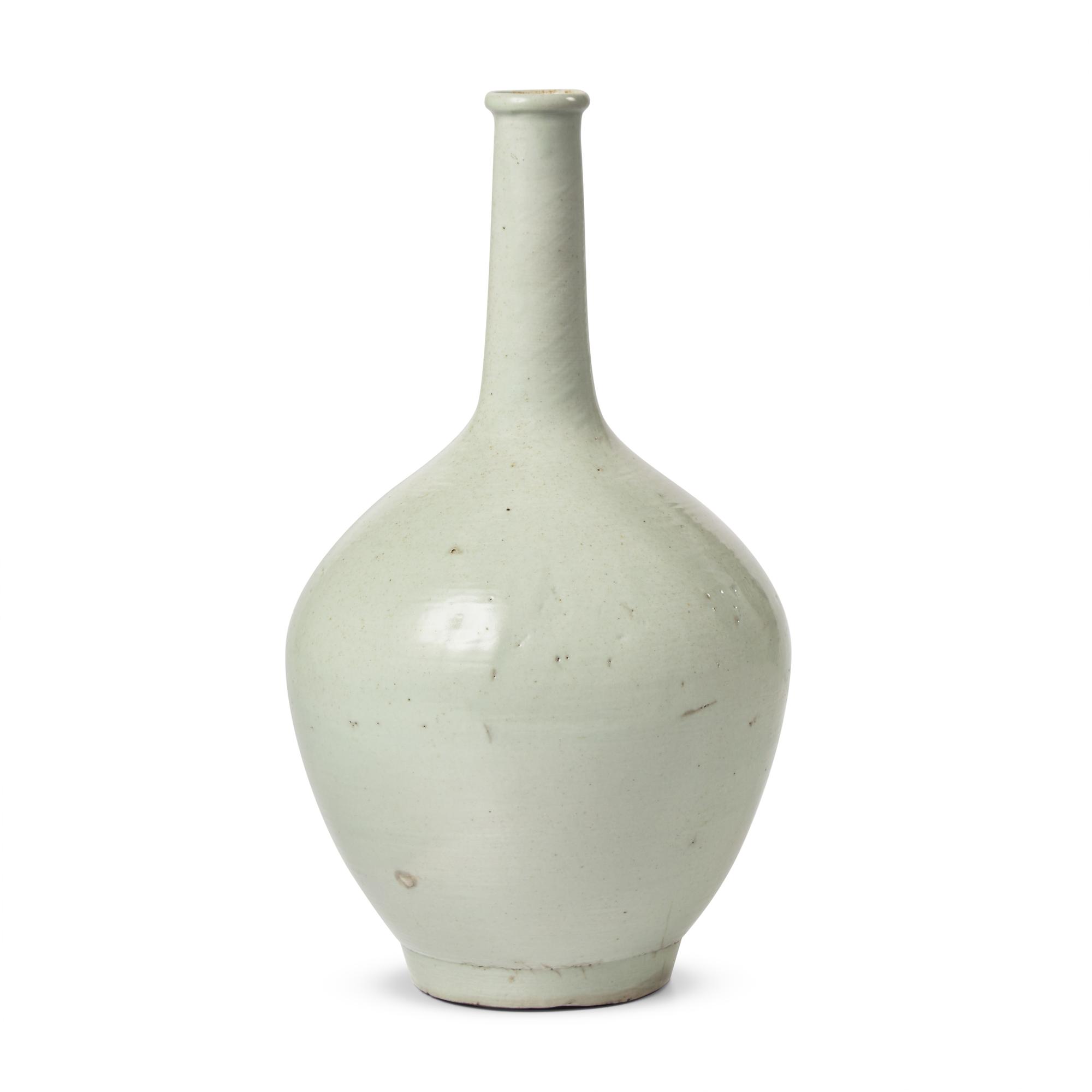 A Korean White Glazed Porcelain Tall-Neck Bottle Vase, Joseon Dynasty, 18th Century