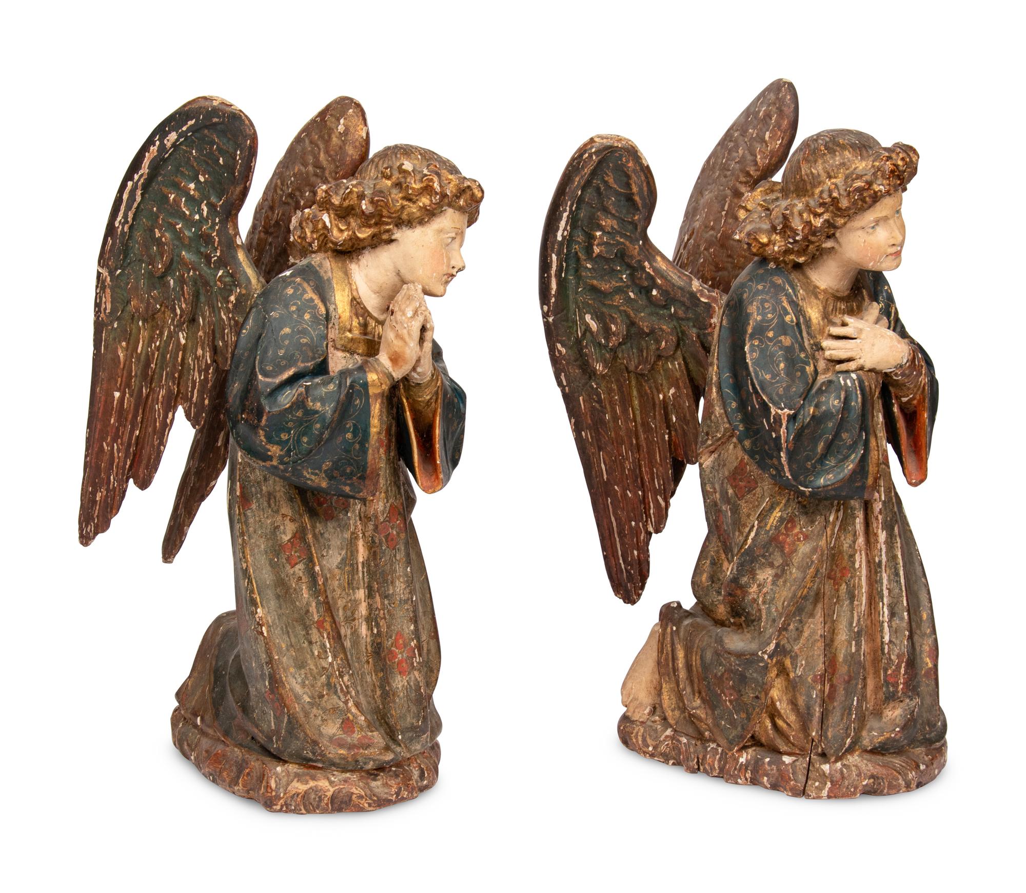 A Pair of Carved and Polychrome Decorated Figures of Kneeling Angels