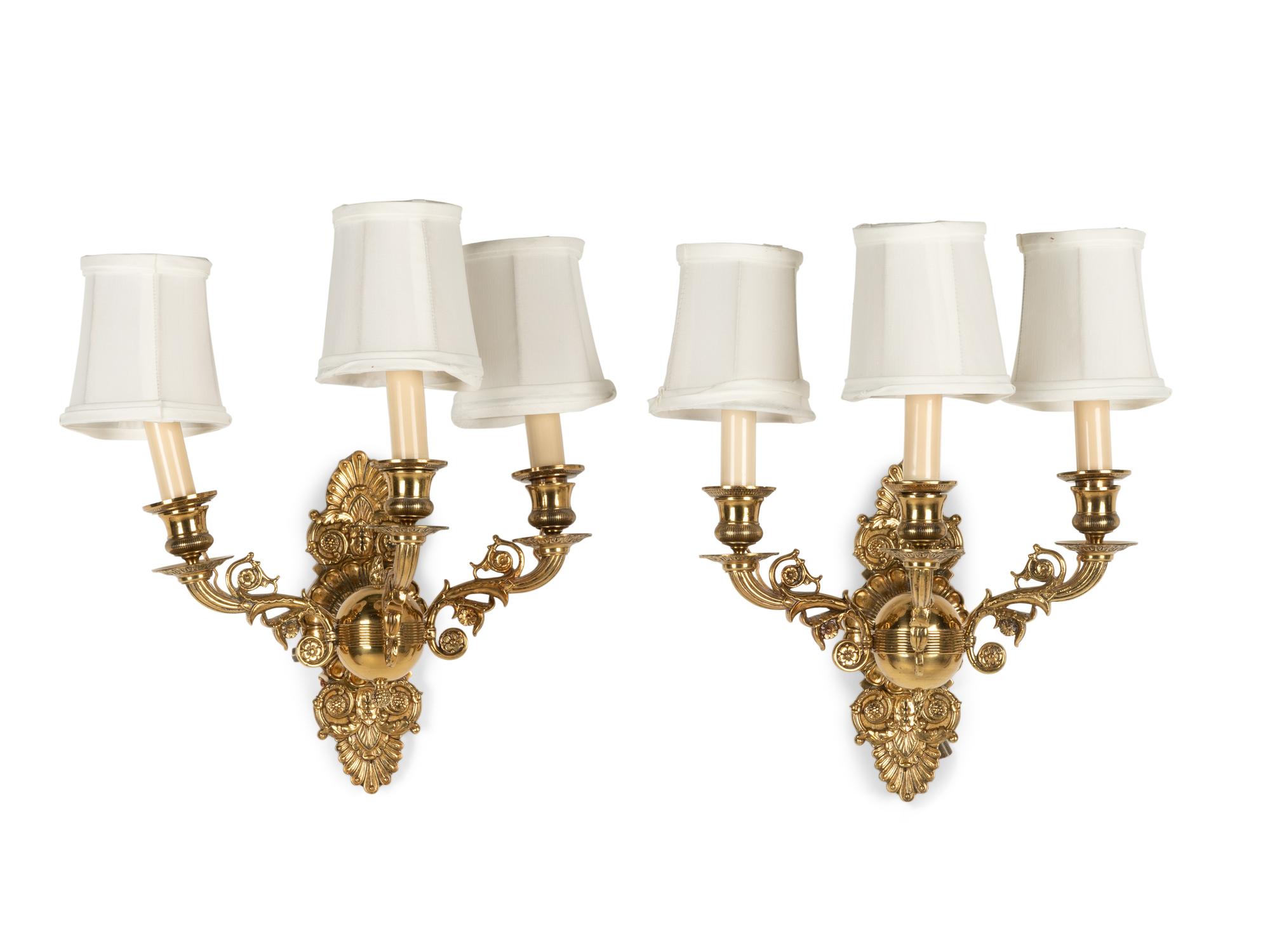 A Pair of Empire Style Brass Three-Light Sconces