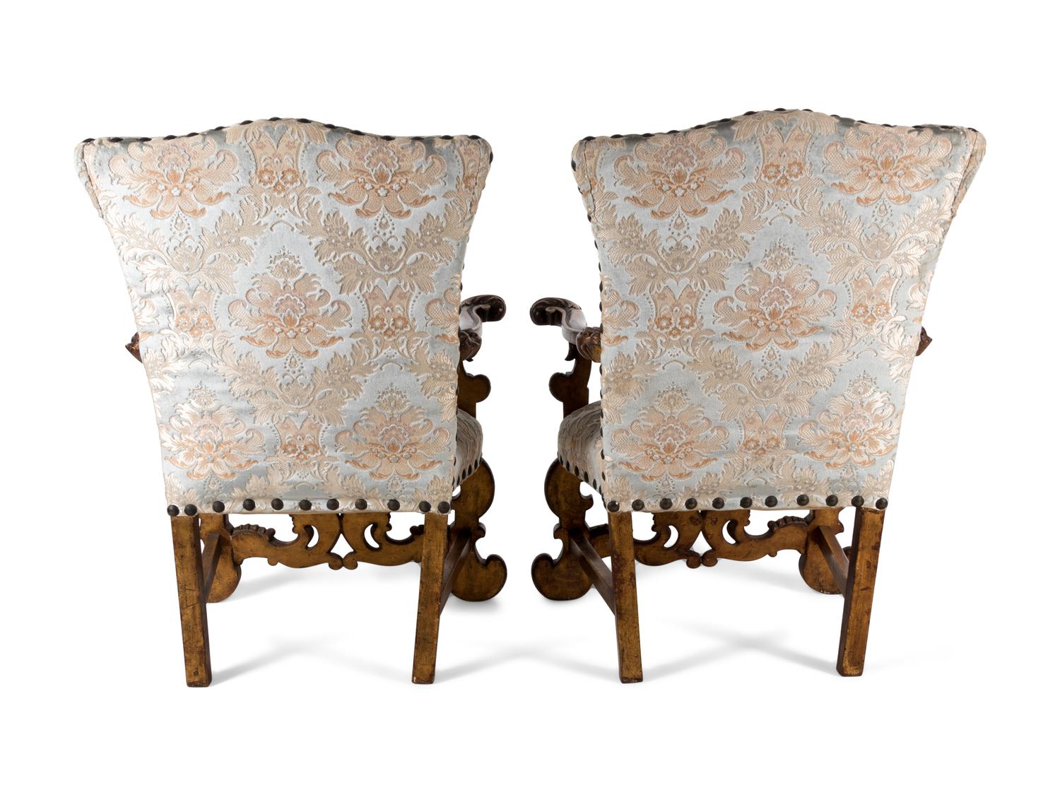A Pair of Italian Baroque Style Parcel Gilt Walnut Armchairs