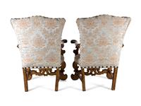A Pair of Italian Baroque Style Parcel Gilt Walnut Armchairs