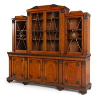 A Regency Mahogany, Ormolu-Mounted and Part Ebonized Breakfront Bookcase