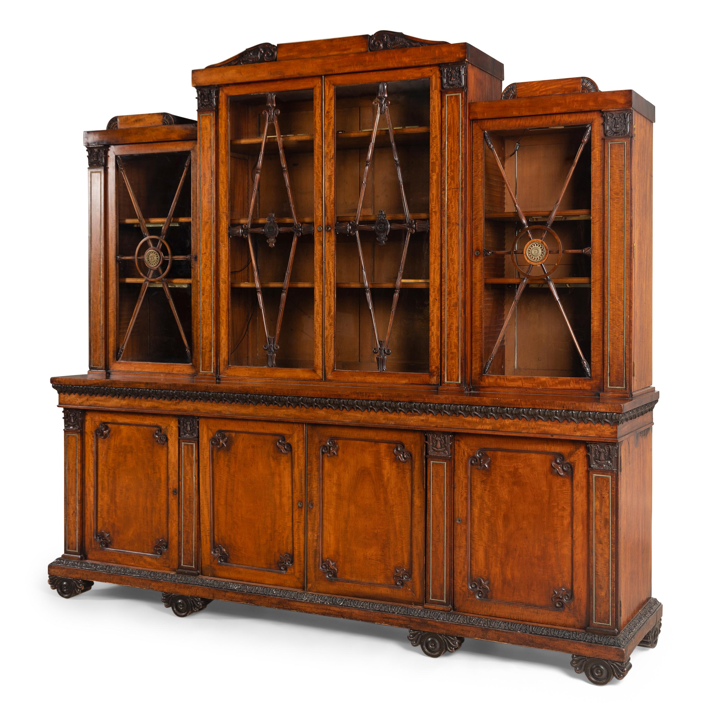 A Regency Mahogany, Ormolu-Mounted and Part Ebonized Breakfront Bookcase