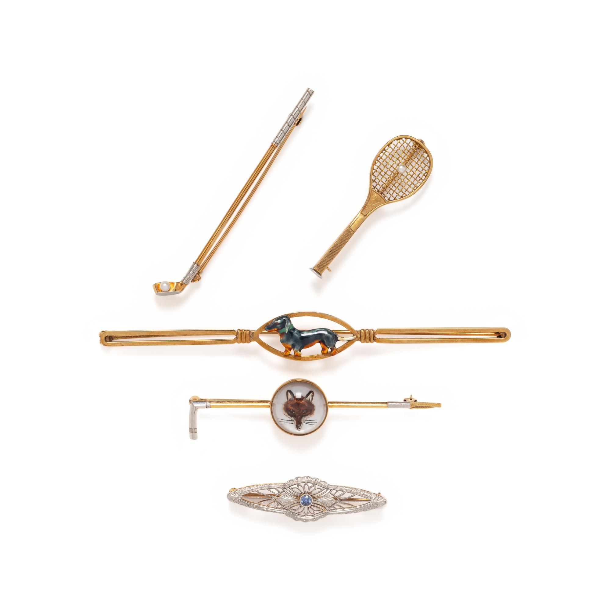 COLLECTION OF GOLD BROOCHES