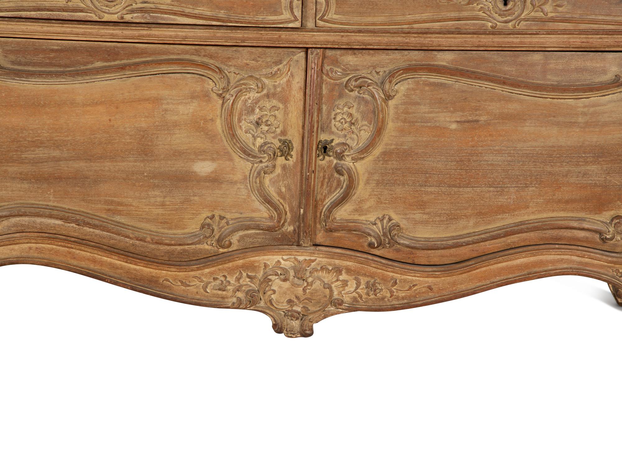 A Rococo Style Carved Bombe Side Cabinet