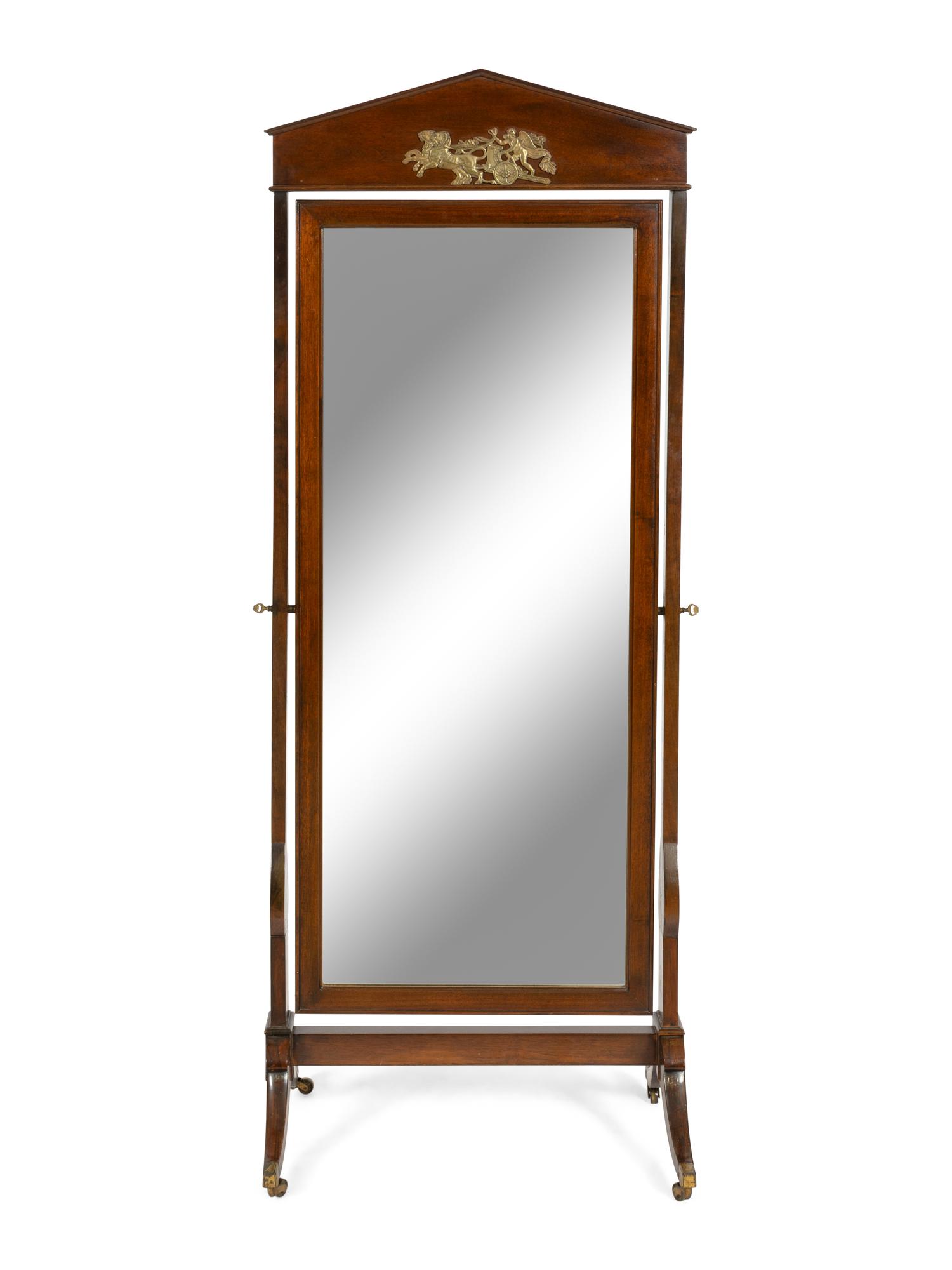 An Empire Style Gilt Metal Mounted Mahogany and Rosewood Cheval Mirror