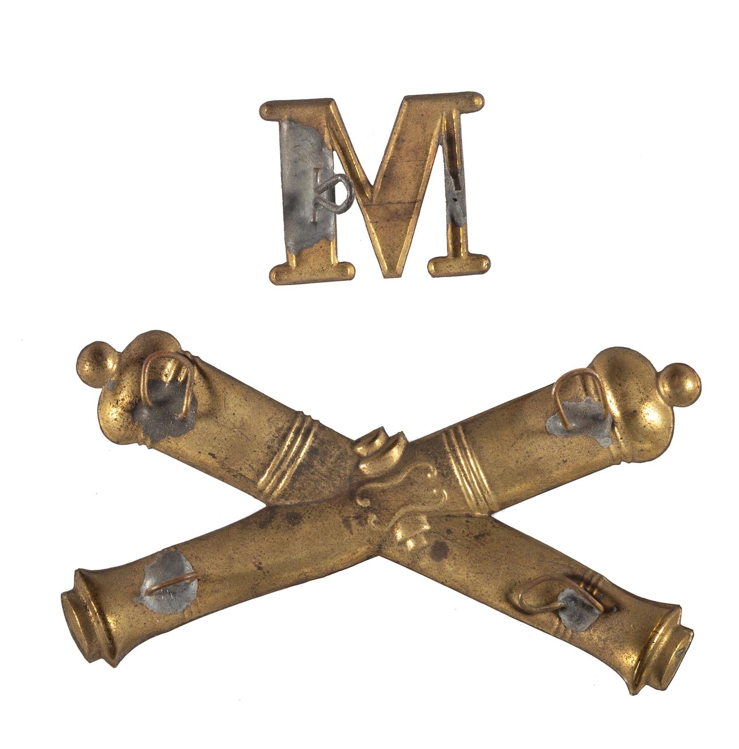 Civil War artillery and company insignia displayed on vintage pasteboard.