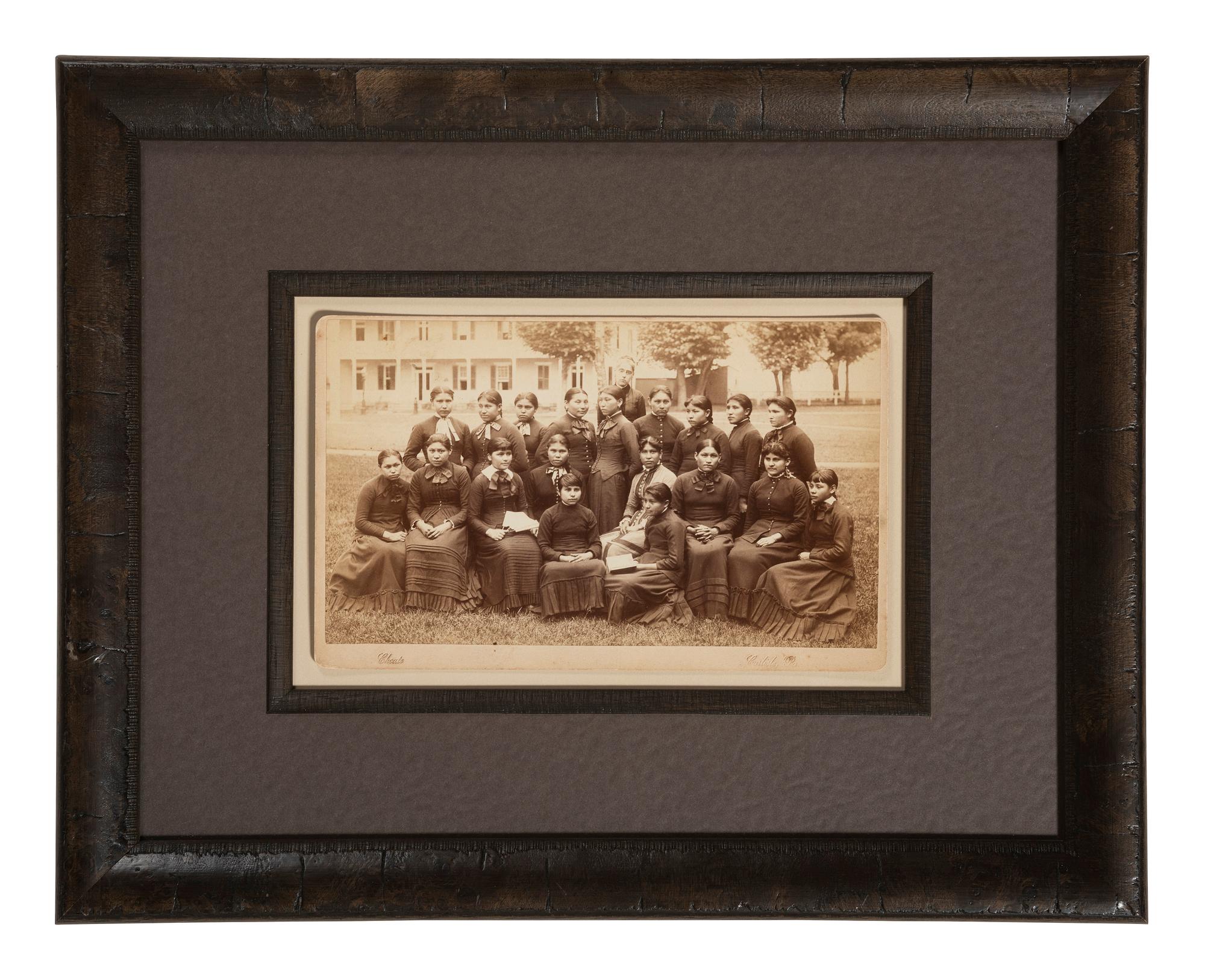 CHOATE, John N. (1848-1902), photographer. Boudoir card of a class of female students with their teacher at Carlisle Indian School. Carlisle, PA, n.d.