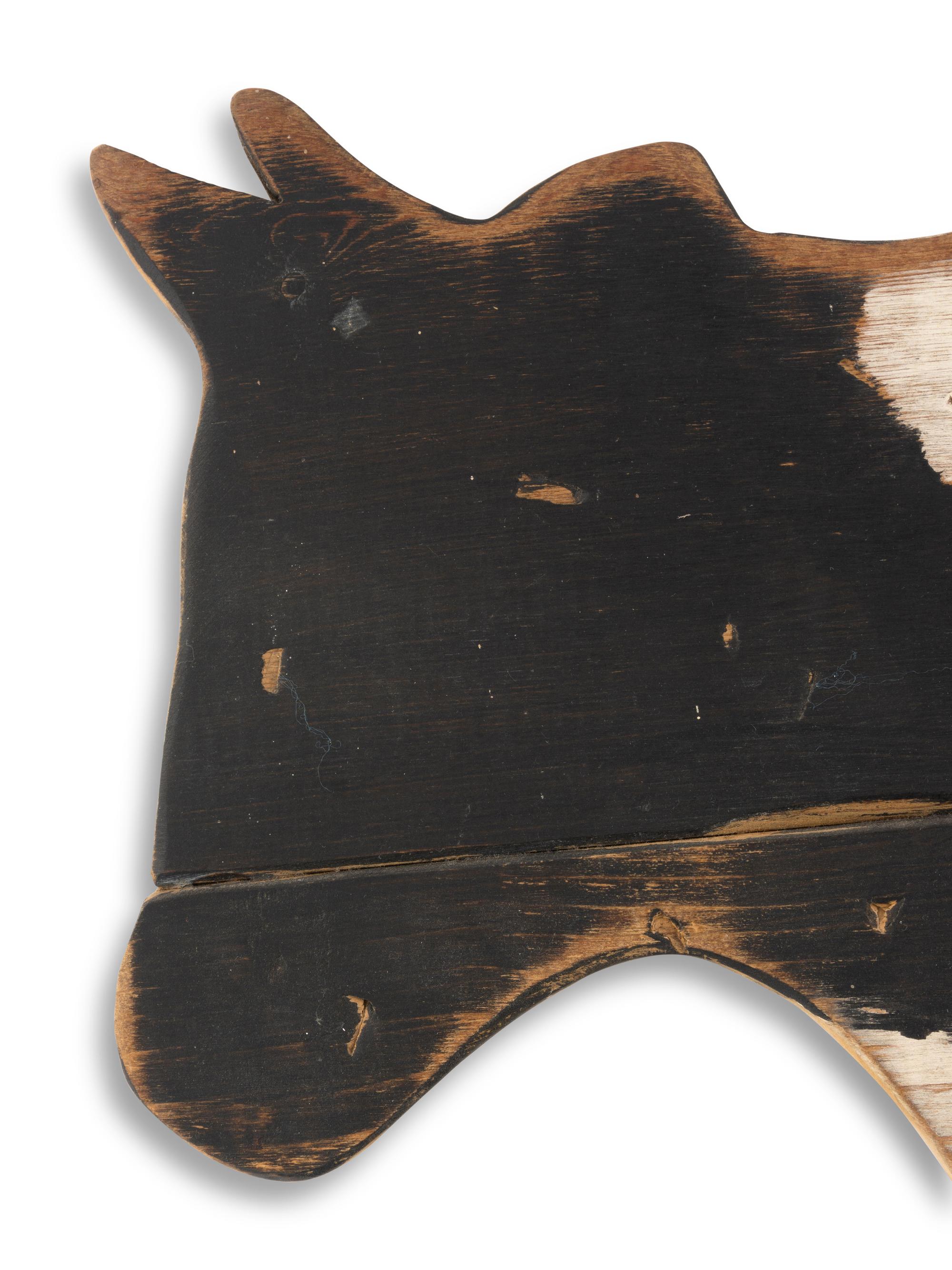 A Carved Wood Cow Form Trade Sign