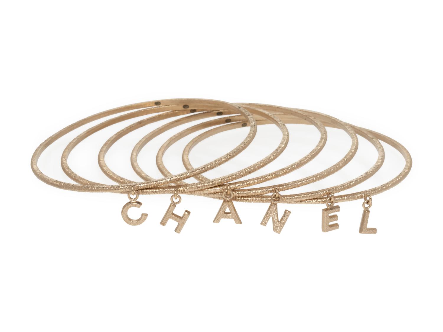 Chanel Set of Goldtone Bangles with "Chanel" Letter Charms, 1997