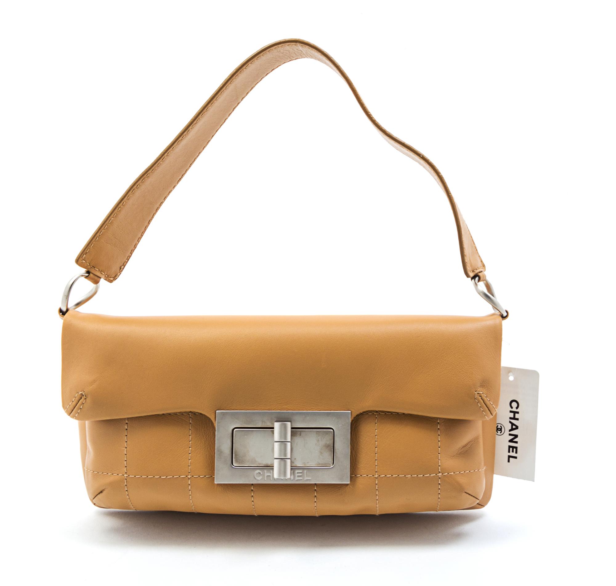 A Chanel Beige Partially Quilted Leather Bag, 11 x 6 x 3 inches.