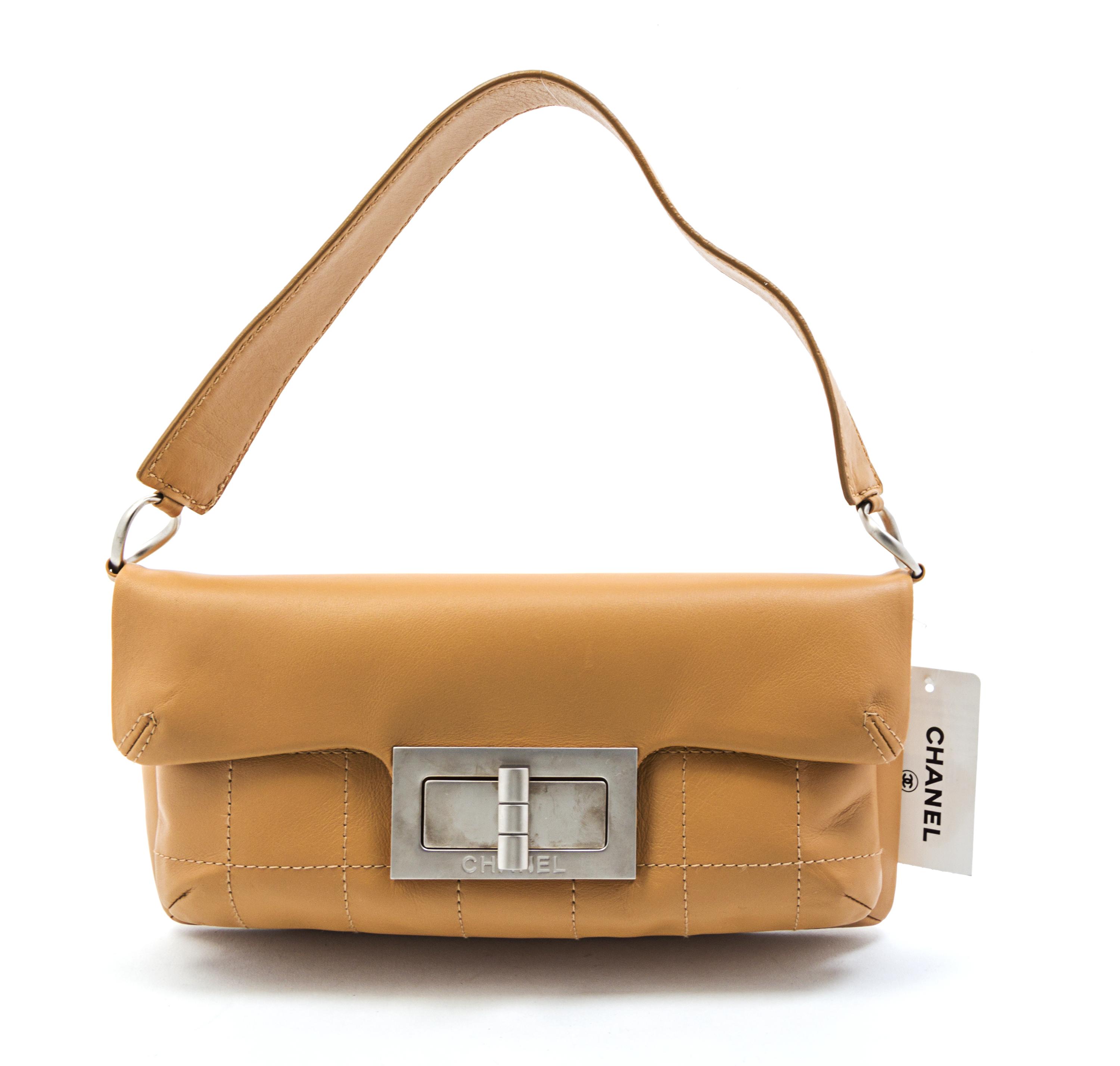 A Chanel Beige Partially Quilted Leather Bag, 11 x 6 x 3 inches.