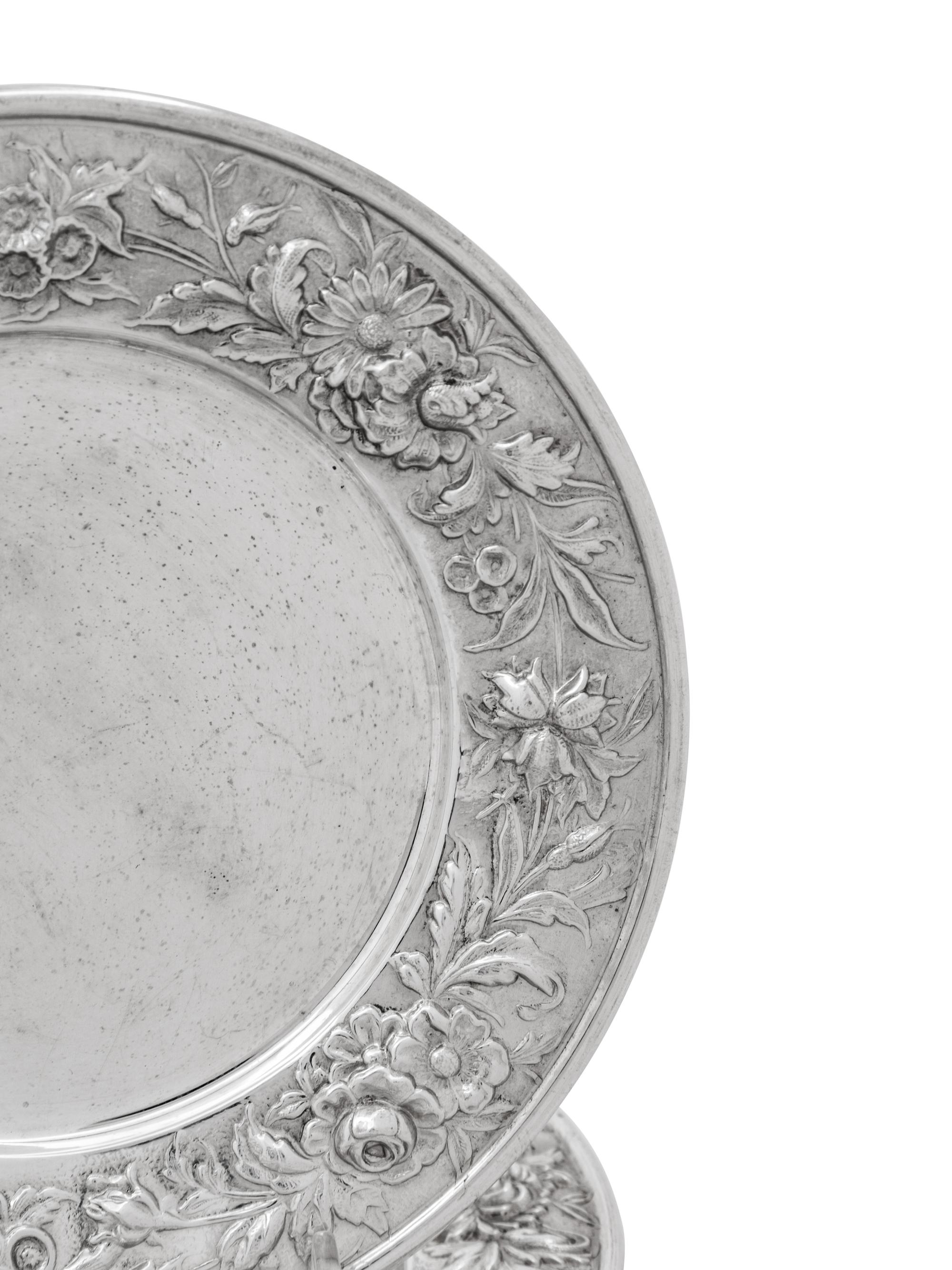 A Set of Eight S. Kirk and Son Repousse Silver Bread Plates