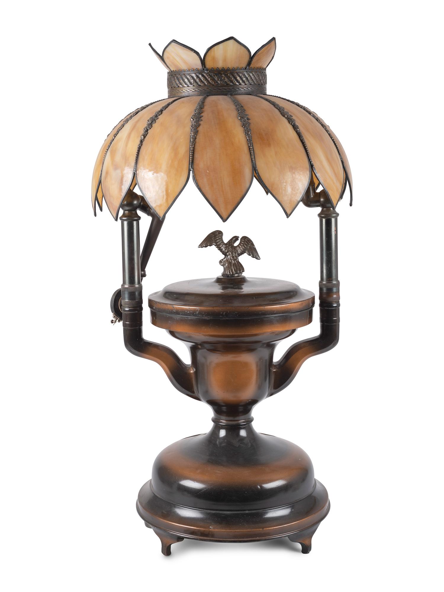 A Fairy Phonograph Patinated Metal Lamp with a Slag Glass Shade