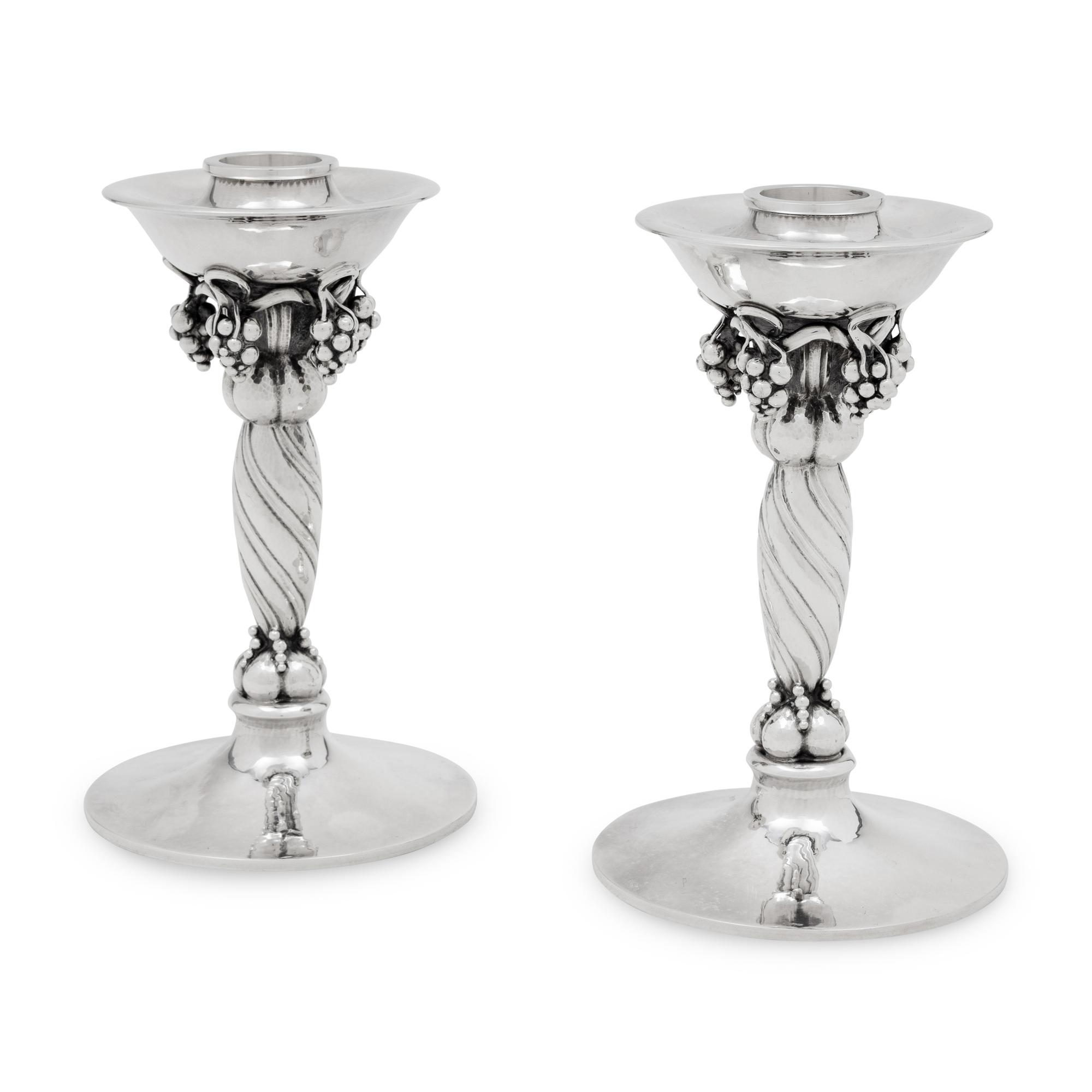 A Pair of Georg Jensen Silver Grape Candlesticks
