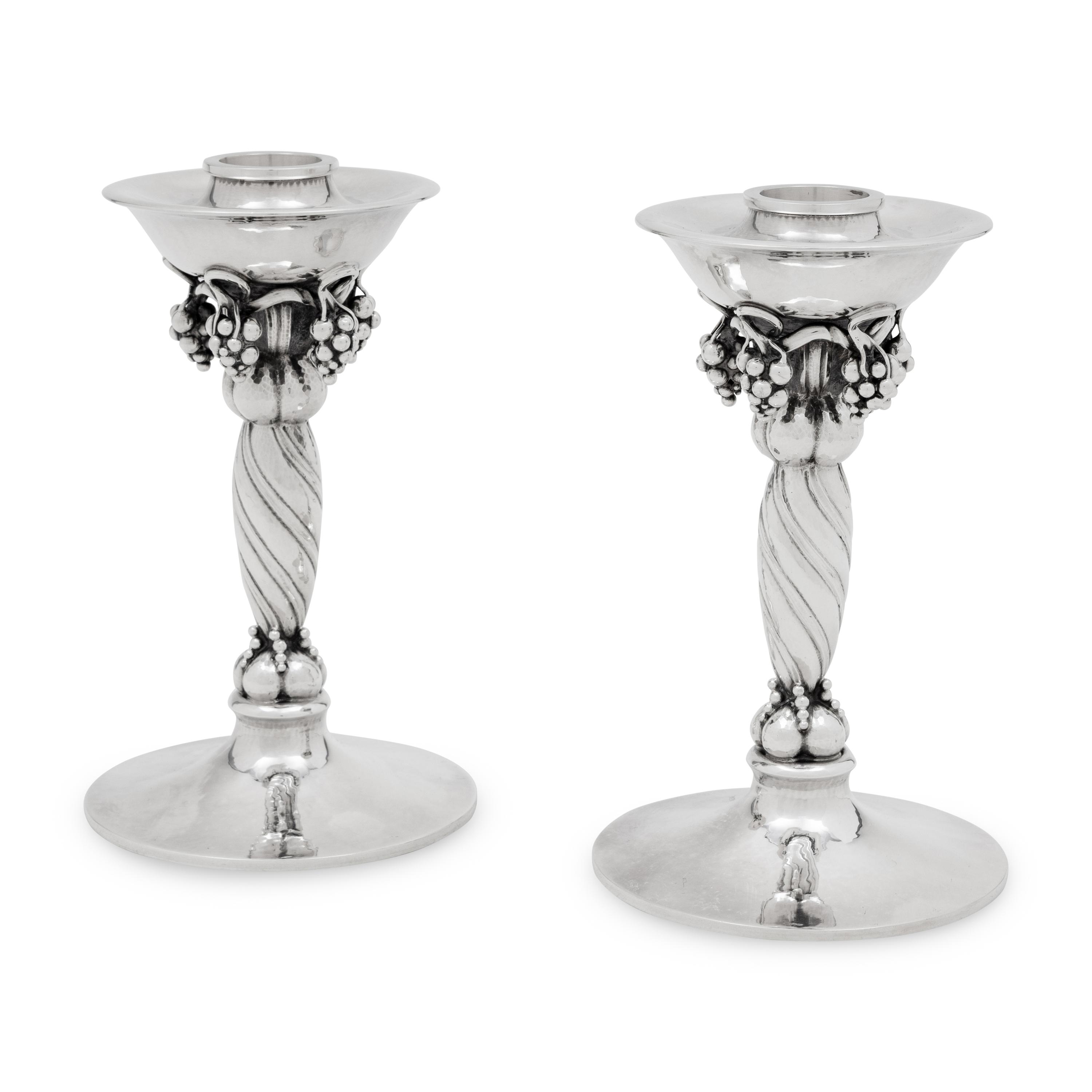 A Pair of Georg Jensen Silver Grape Candlesticks
