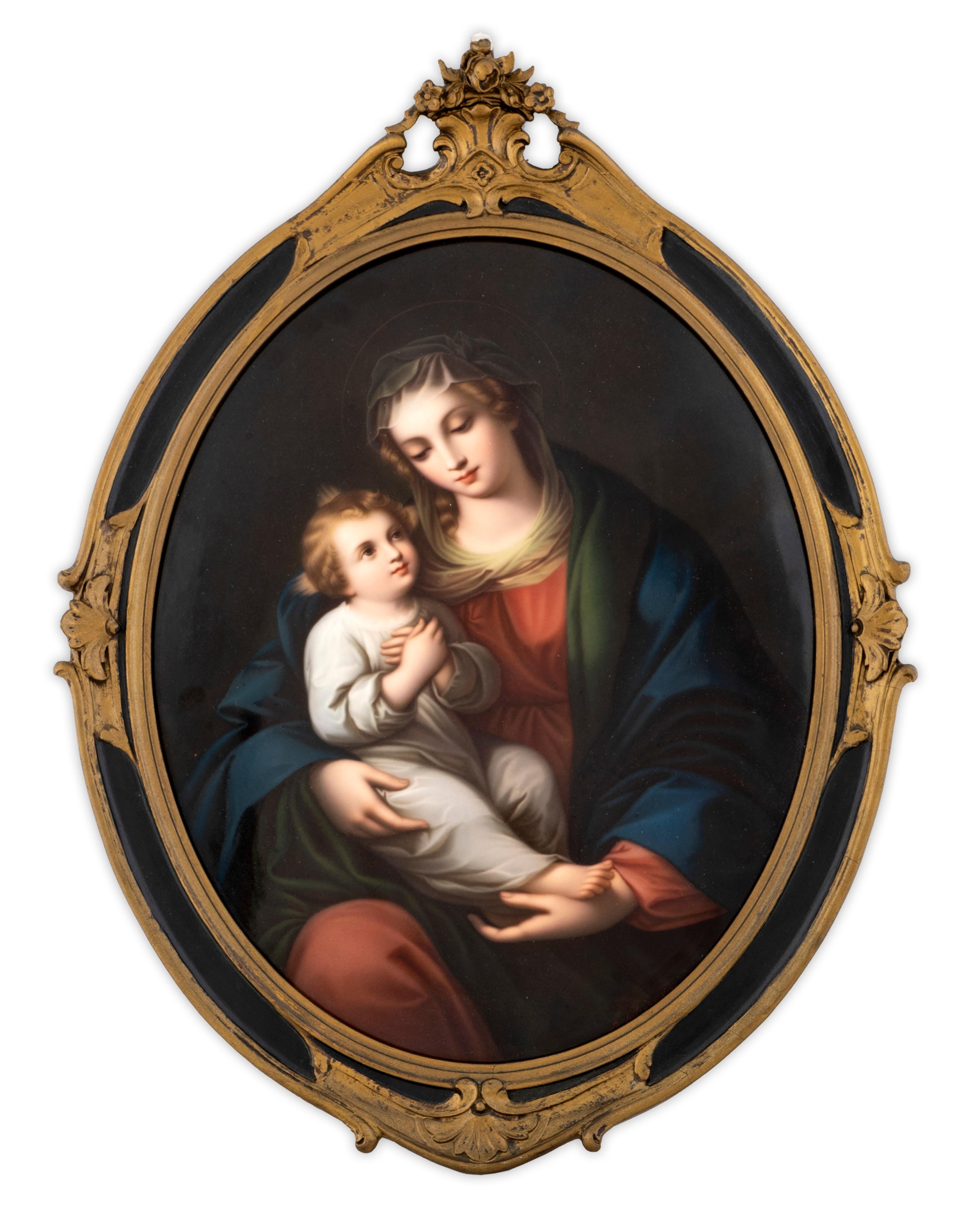 A German Porcelain Oval Plaque Depicting the Madonna and Child — CIRCA 1900