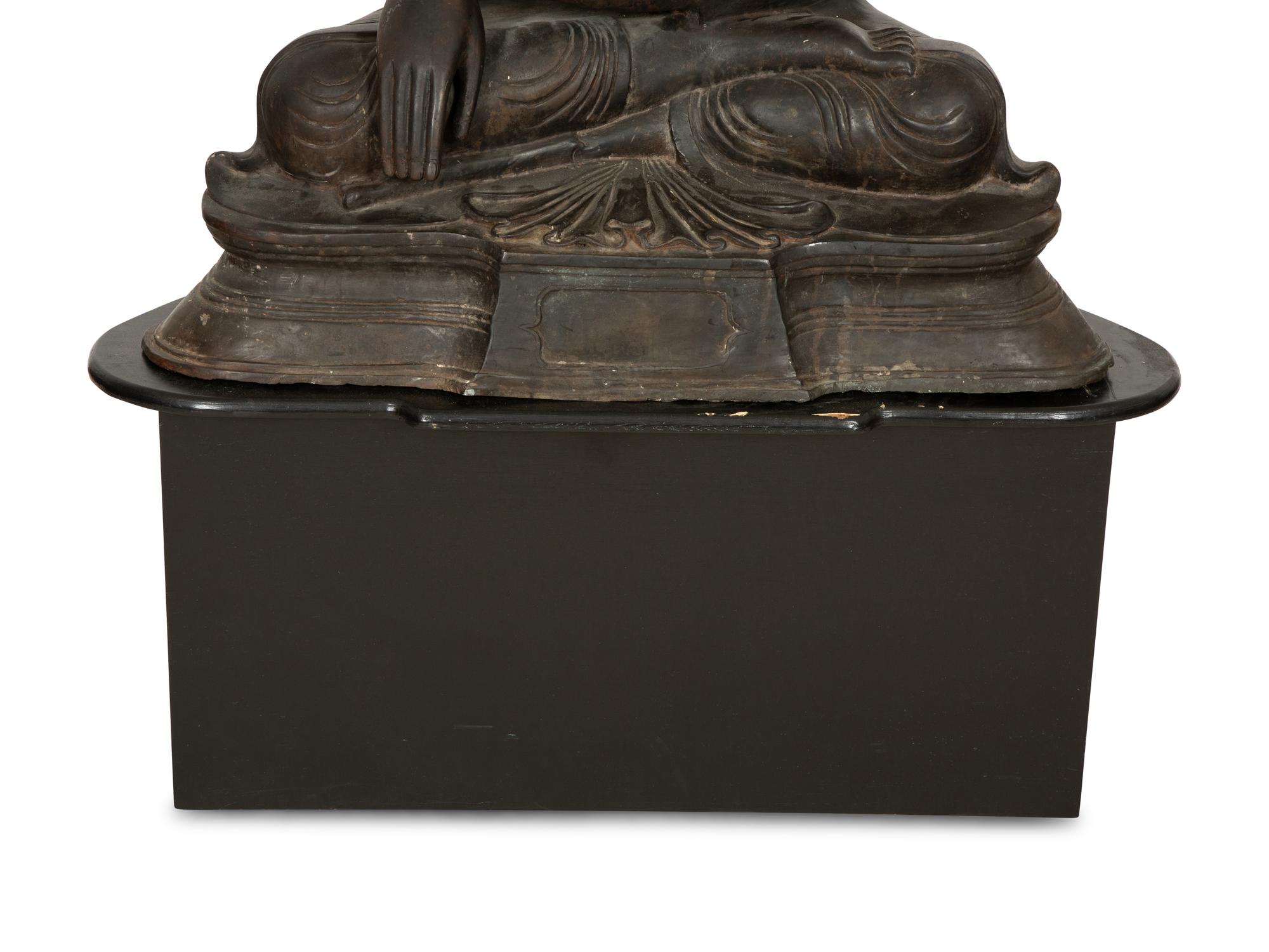 A Large Southeast Asian Bronzed Metal Seated Buddha