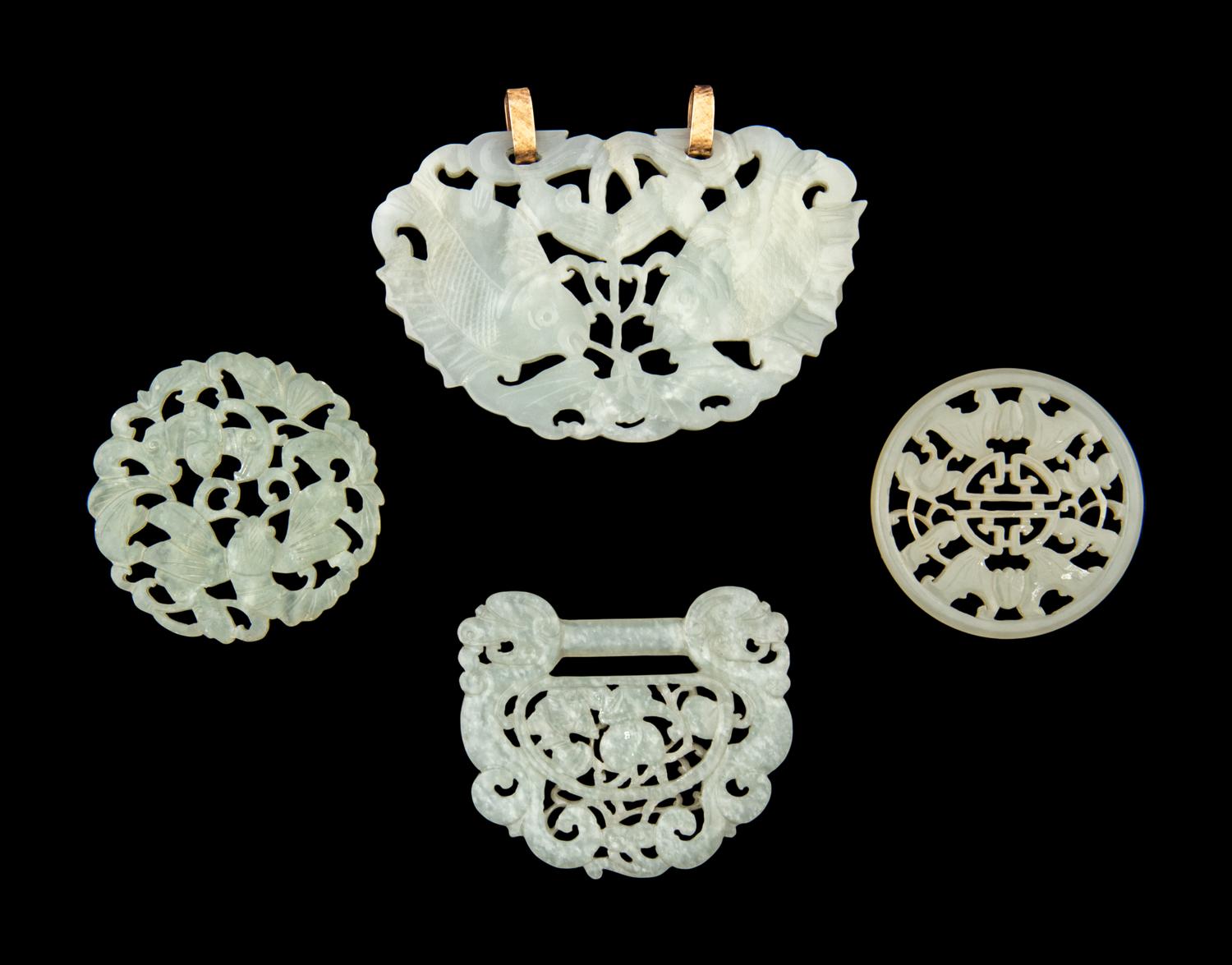 Four Chinese Reticulated Jade and Serpentine Pendants