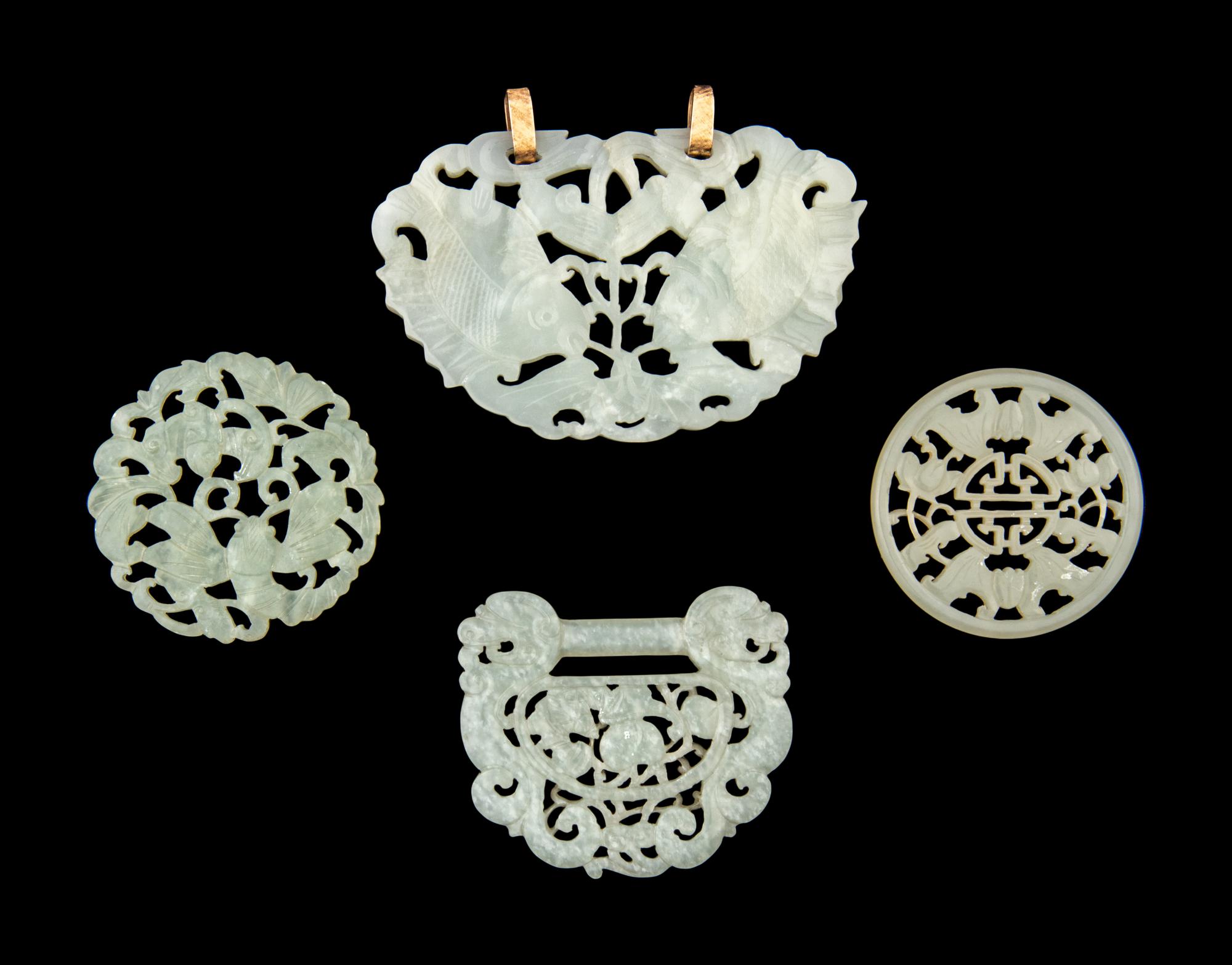 Four Chinese Reticulated Jade and Serpentine Pendants