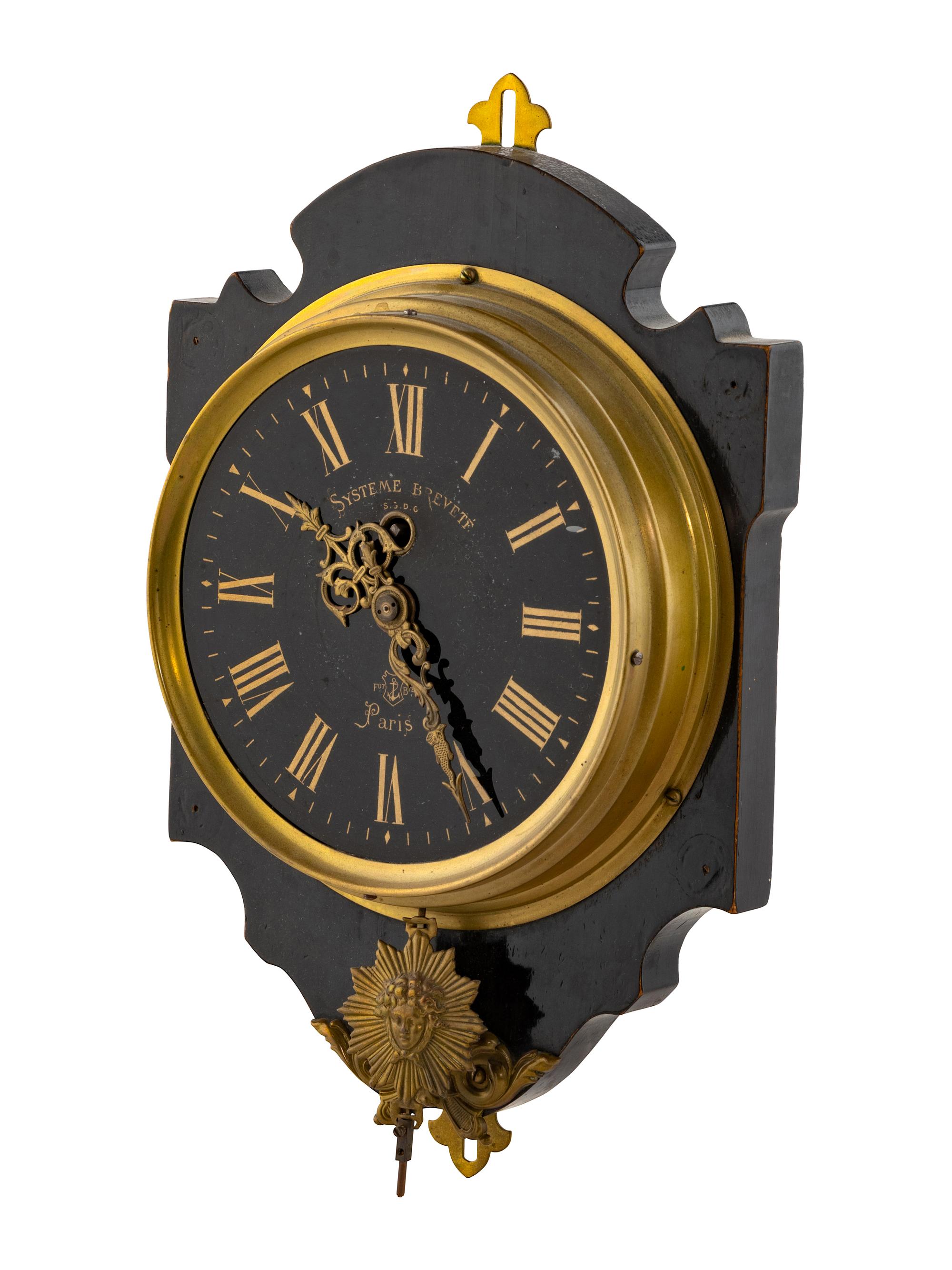 A French Gilt Metal Mounted Ebonized Wall Clock