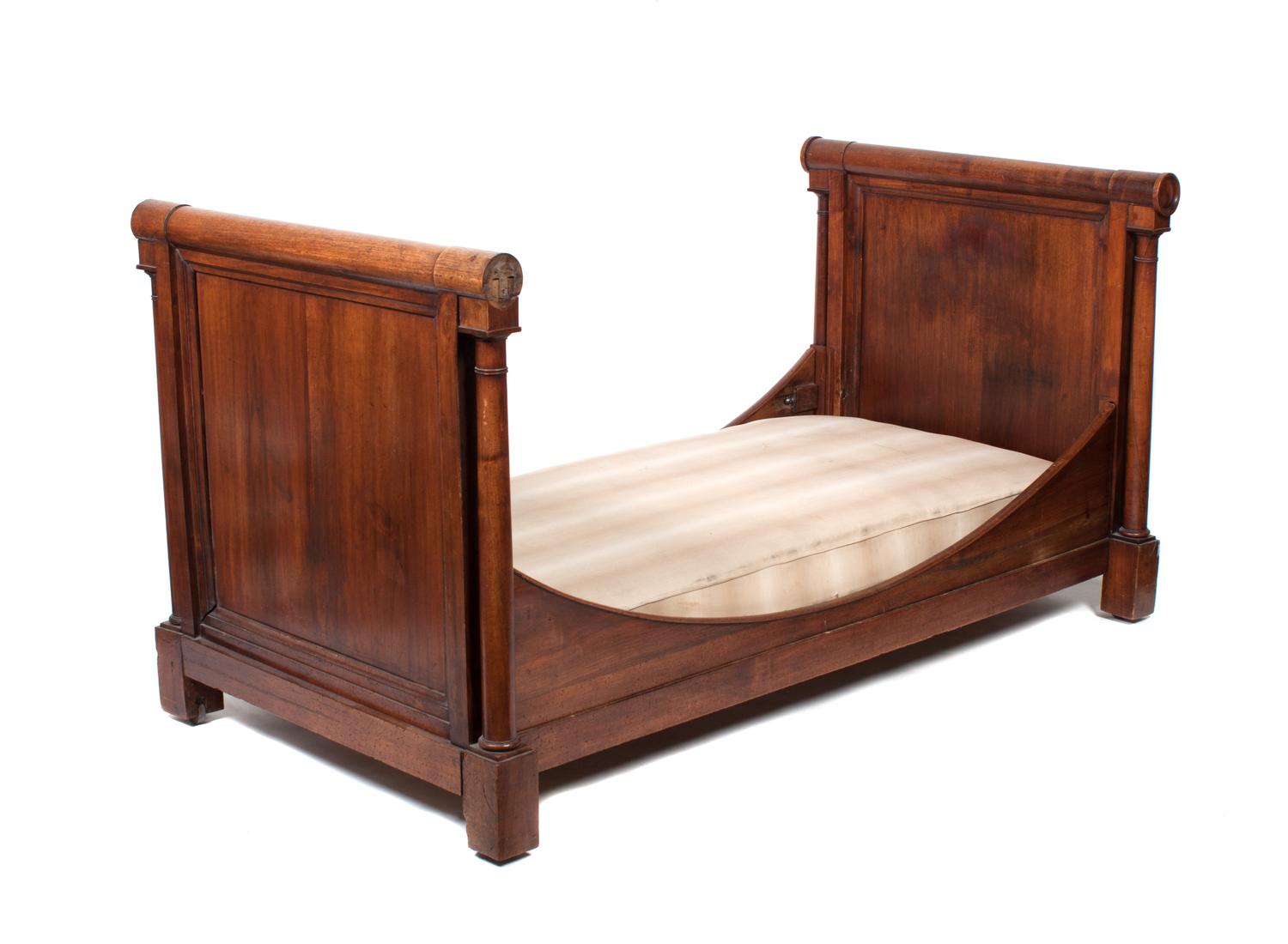 An Empire Style Walnut Daybed Height 39 1/2 x width 79 1/2 x depth 40 1/2 inches.