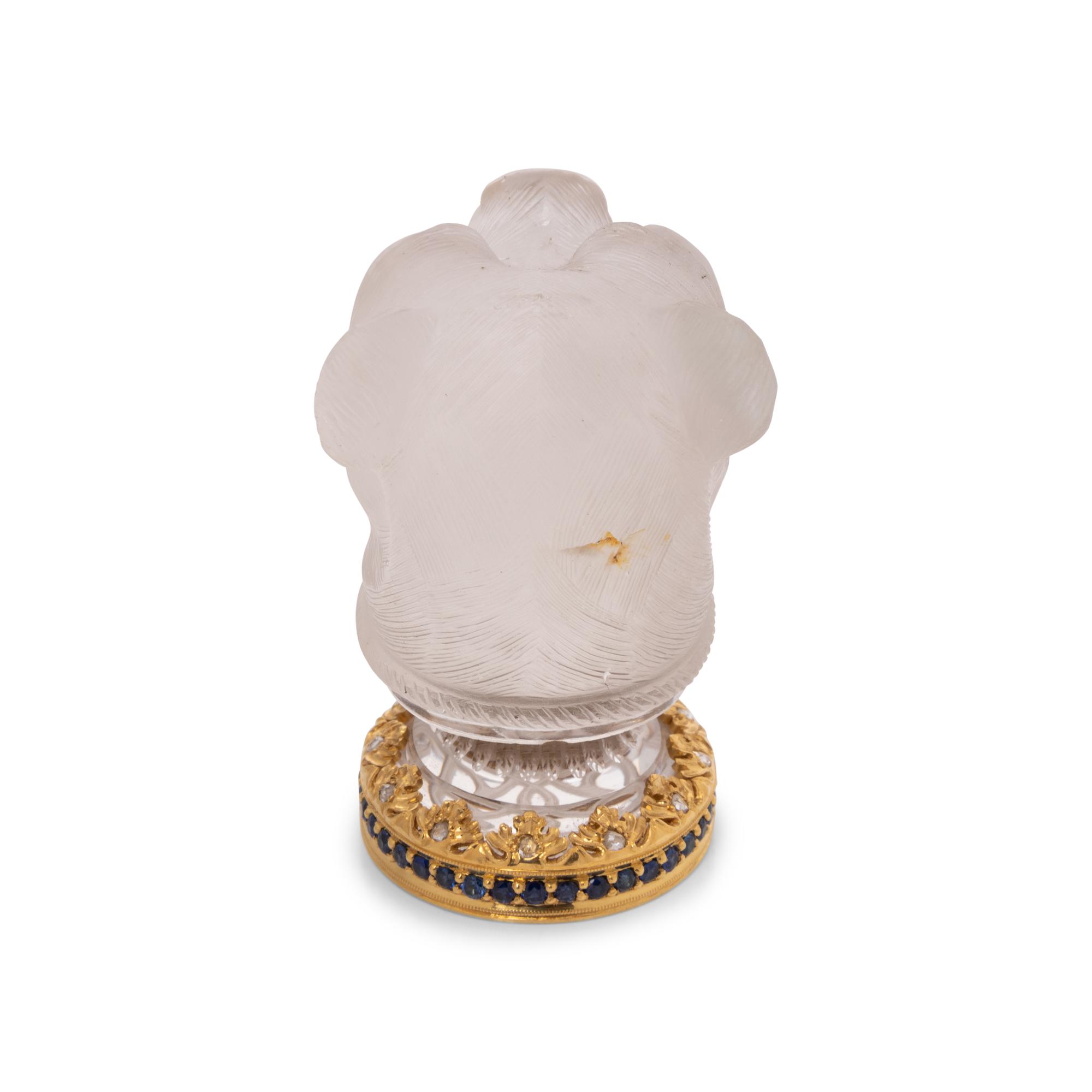 A Continental Gold, Diamond and Sapphire Mounted Carved Rock Crystal Hand-Seal