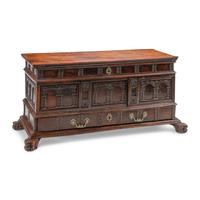 A Continental Carved Walnut Cassone