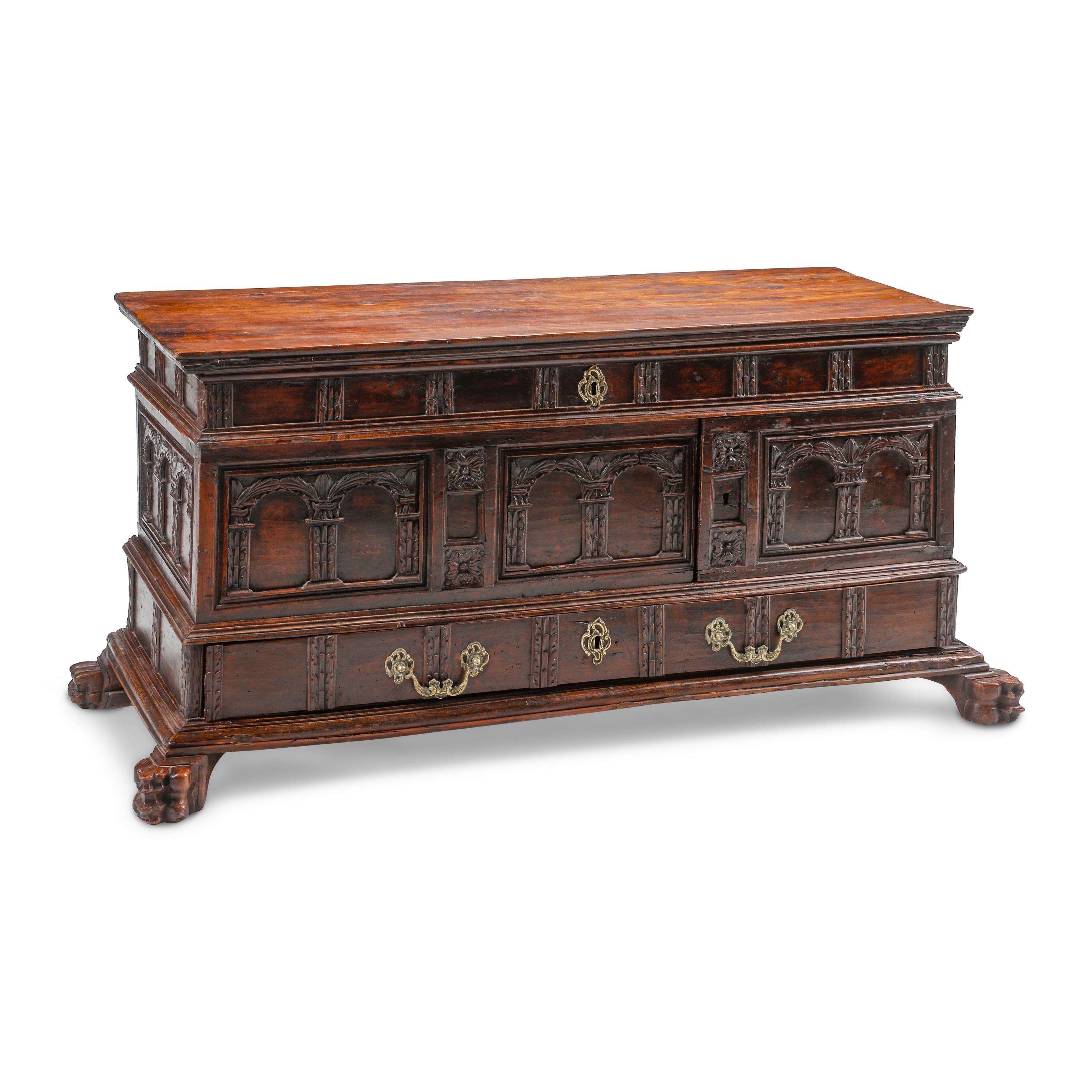 A Continental Carved Walnut Cassone