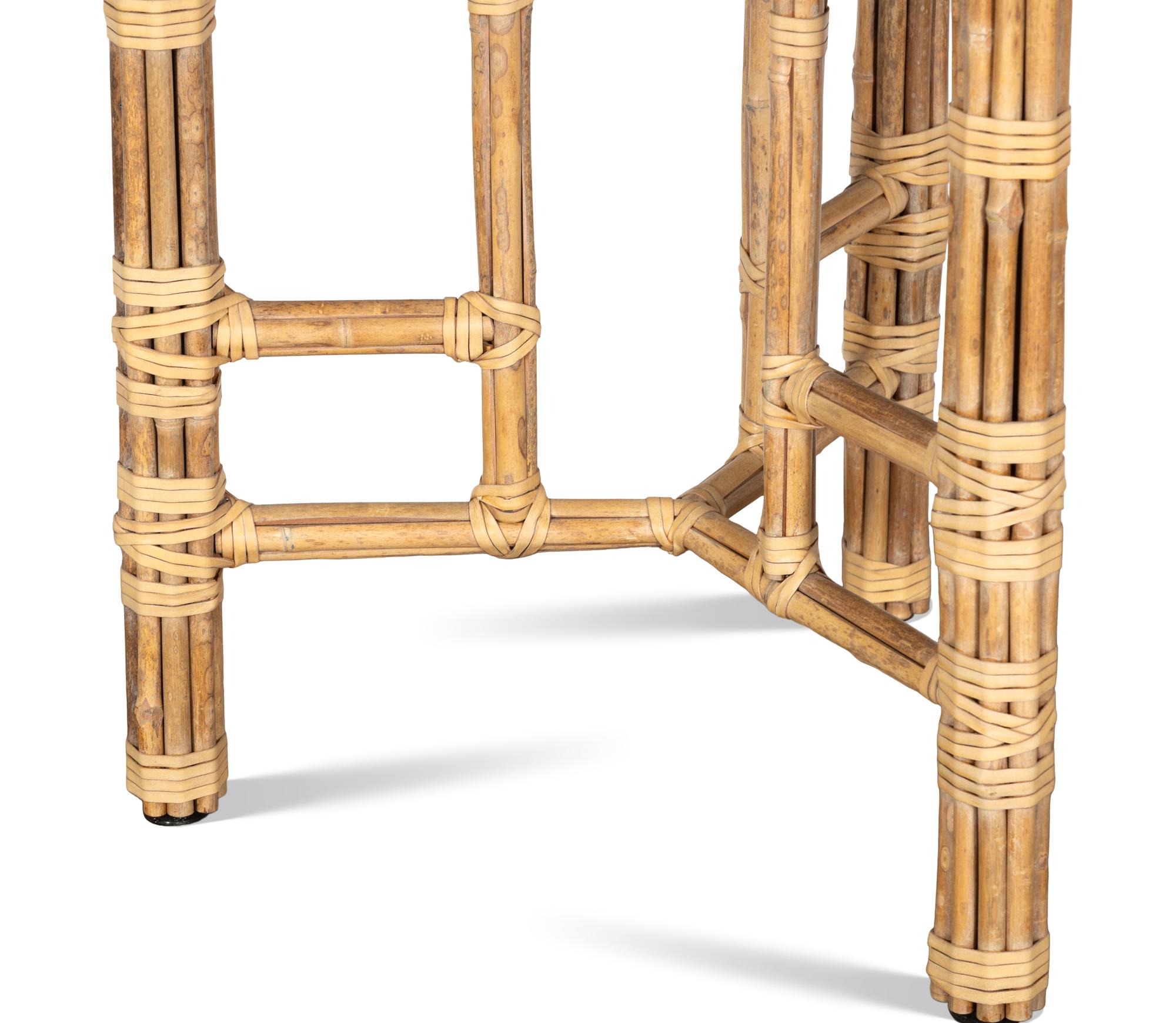 A Set of Four McGuire Rattan Target Armchairs and an Organic Bamboo Table