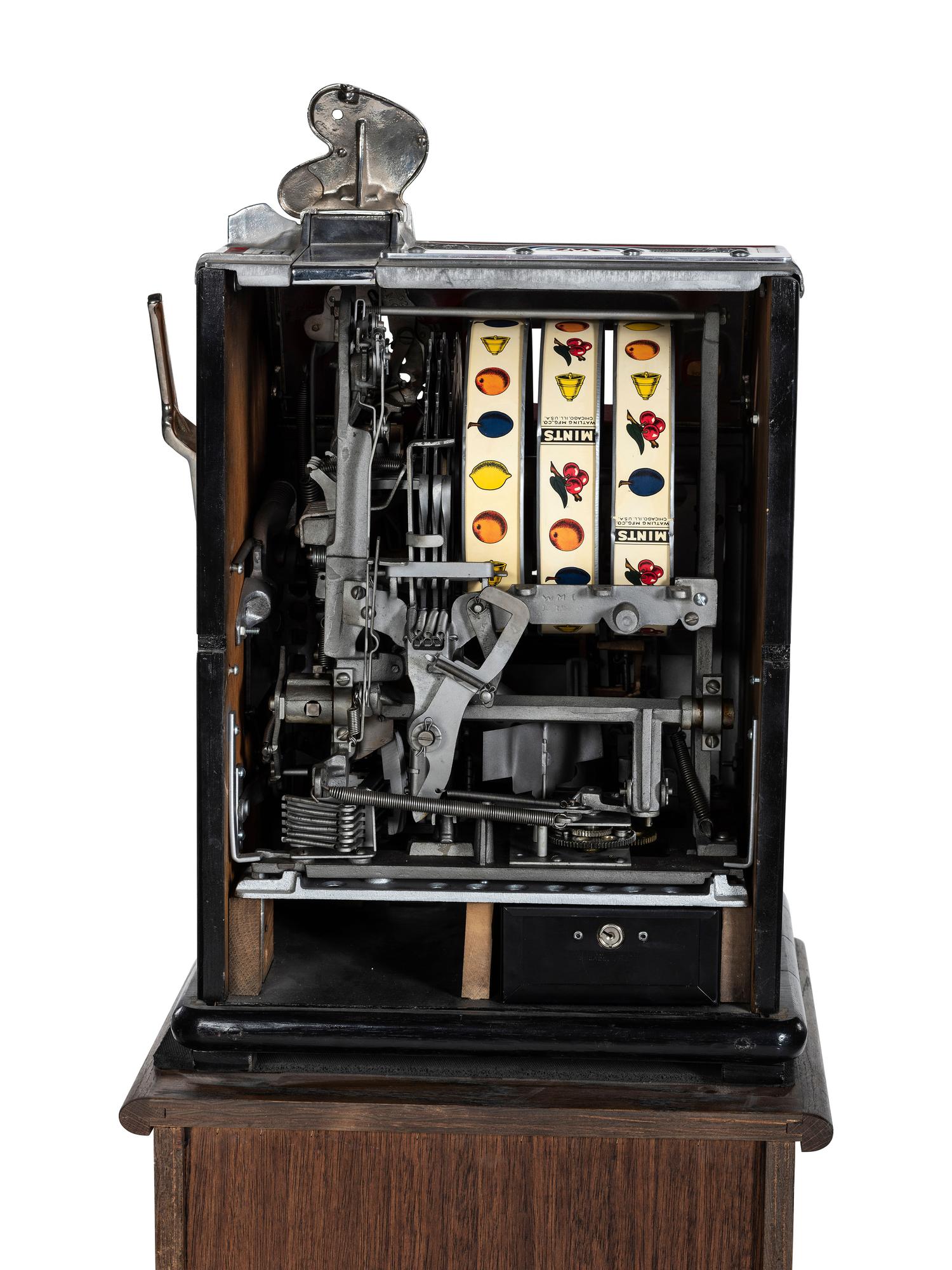 A Watling 1 Cent Dual Jackpot Gum Dispenser Slot Machine on Reverse Printed Glass Inset Golden Nugget Stand