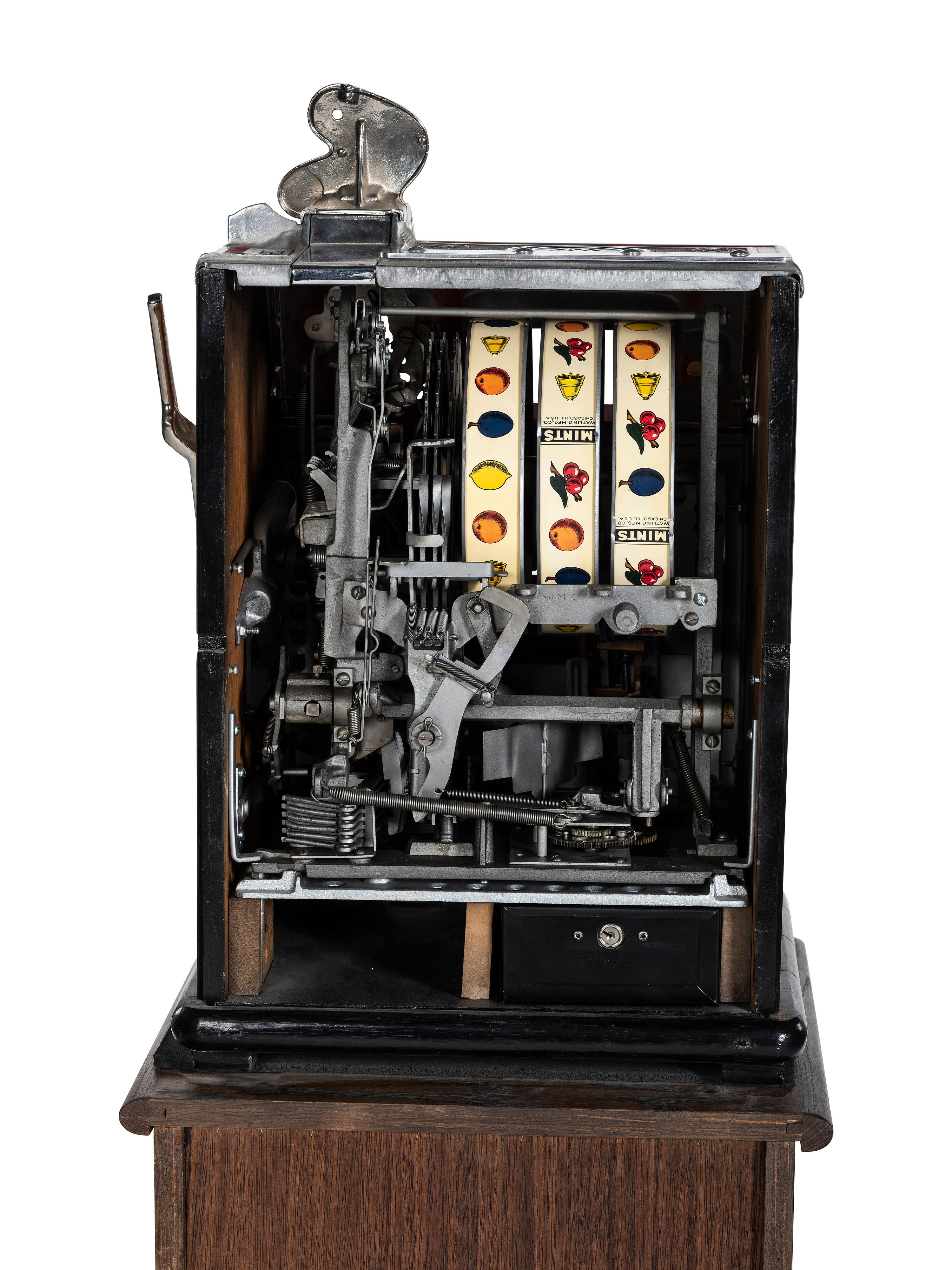A Watling 1 Cent Dual Jackpot Gum Dispenser Slot Machine on Reverse Printed Glass Inset Golden Nugget Stand