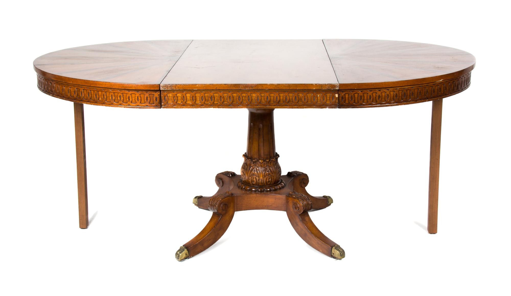 A Continental Inlaid Walnut Table Diameter 44 inches (closed); width of each leaf 23 7/8 inches. — 20TH CENTURY