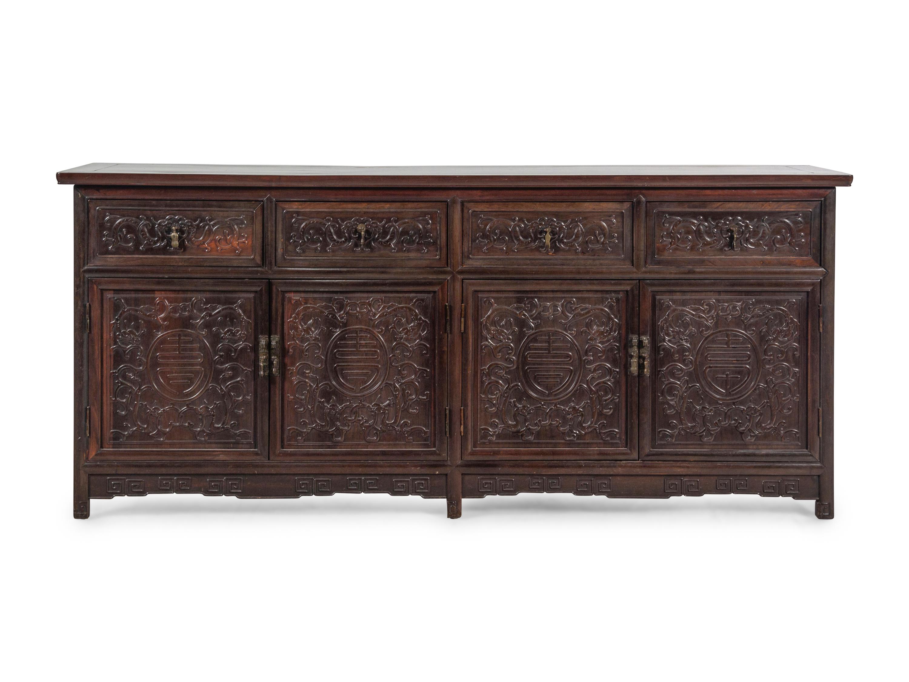A Chinese Export Carved Hardwood Console Cabinet